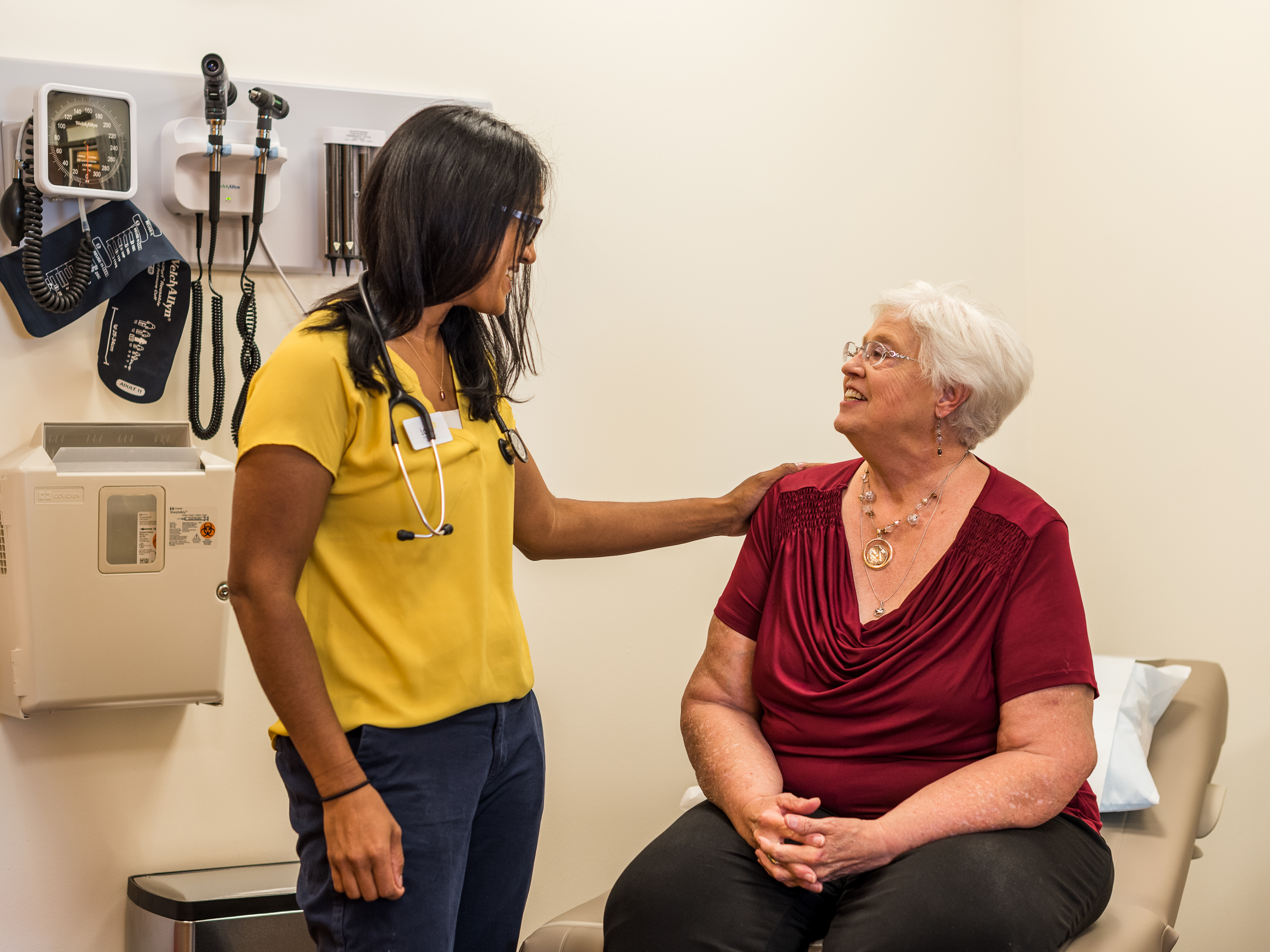 A patient consulting with a medical professional at an Iora Health clinic.