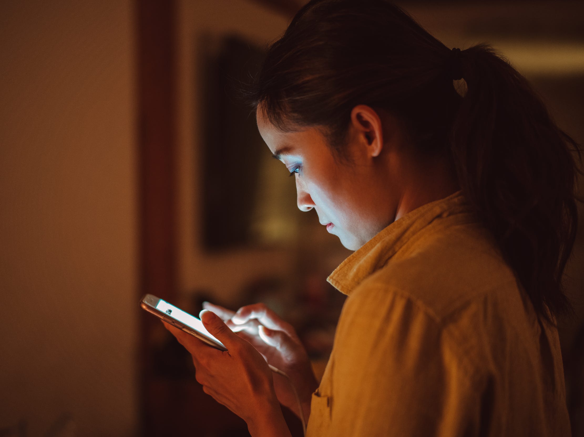 woman texting on smart phone using cell