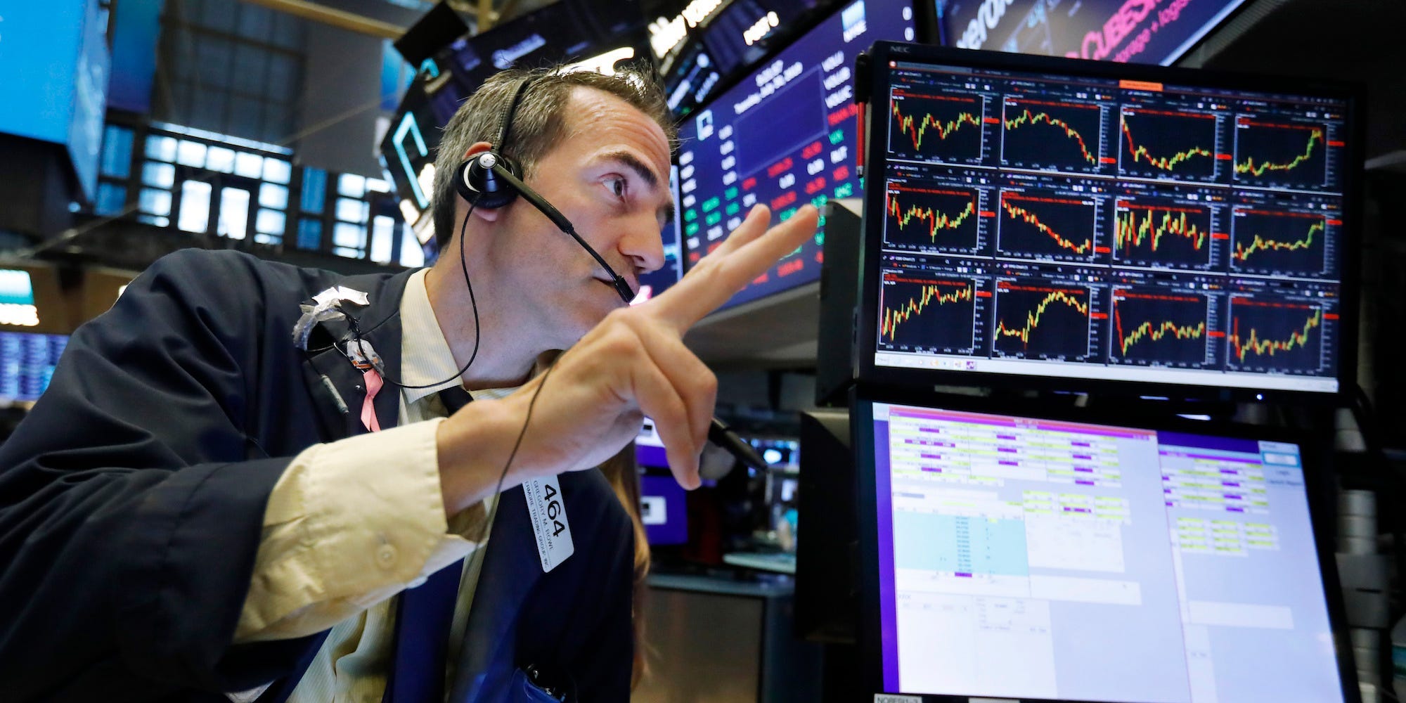 trader nyse screen fingers point