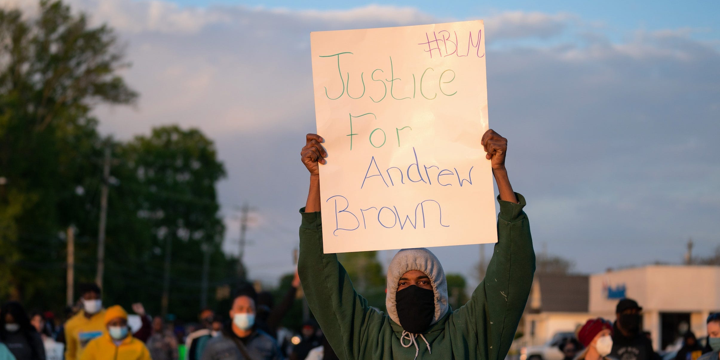 demonstrator holds a sign for Andrew Brown Jr. during a protest march on April 22, 2021 in Elizabeth City, North Carolina. The protest was sparked by the police killing of Brown on April 21.