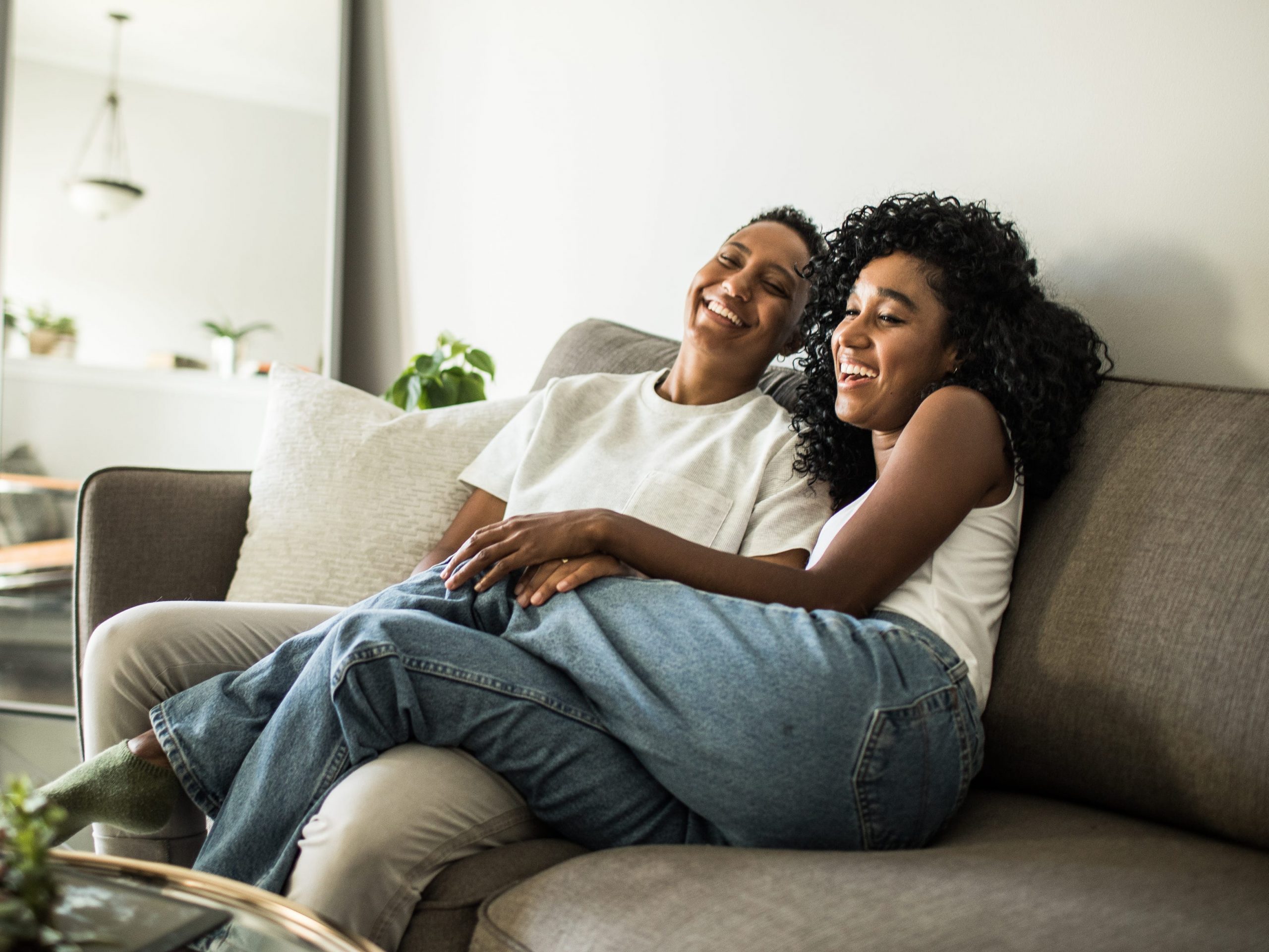millennial couple laughing