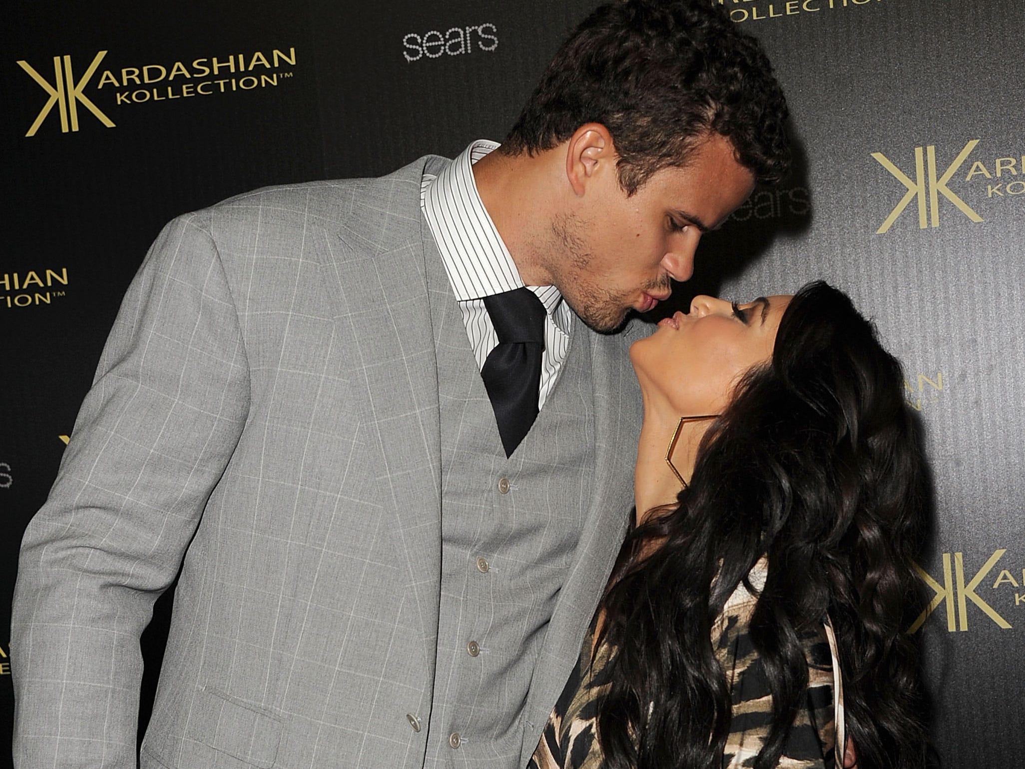 Kim Kardashian and Kris Humphries kiss.