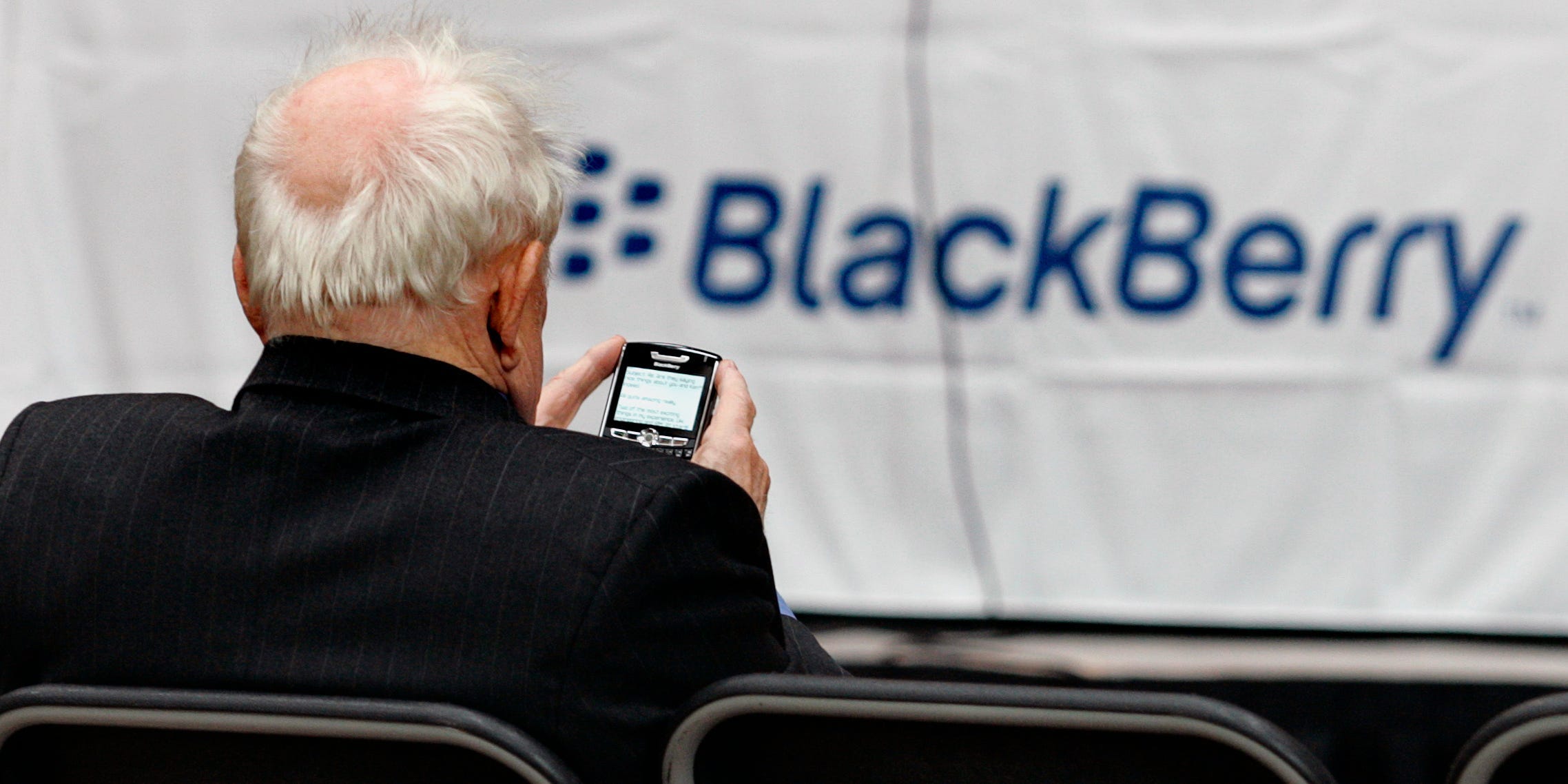 A shareholder uses his Blackberry while waiting for the Research In Motion annual meeting to begin in Waterloo, July 17, 2007.