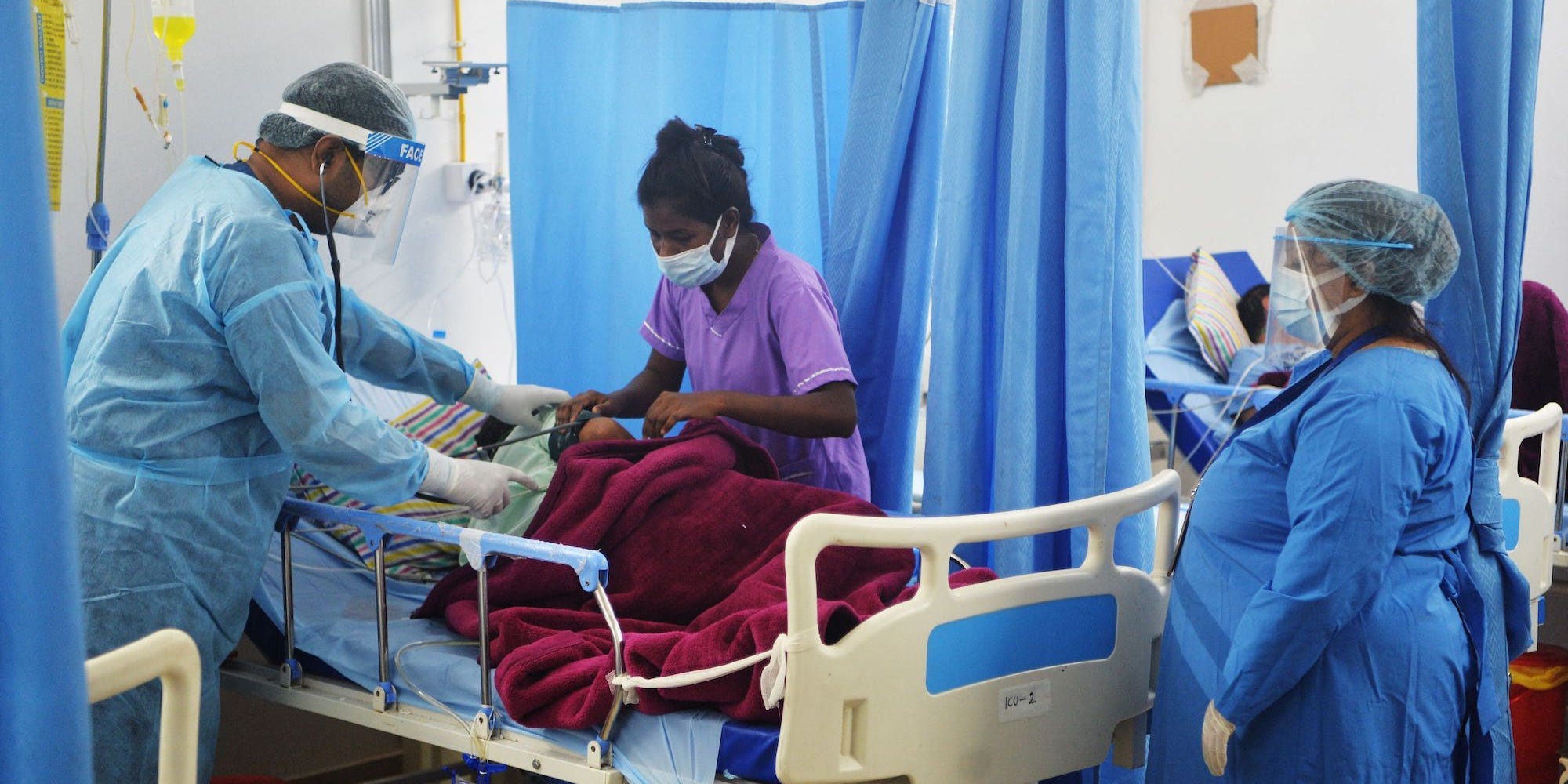 A doctor checks on a COVID-19 patient at an Intensive Care Unit of the Nightingale Hospital, on the outskirts of Siliguri on June 1, 2021.