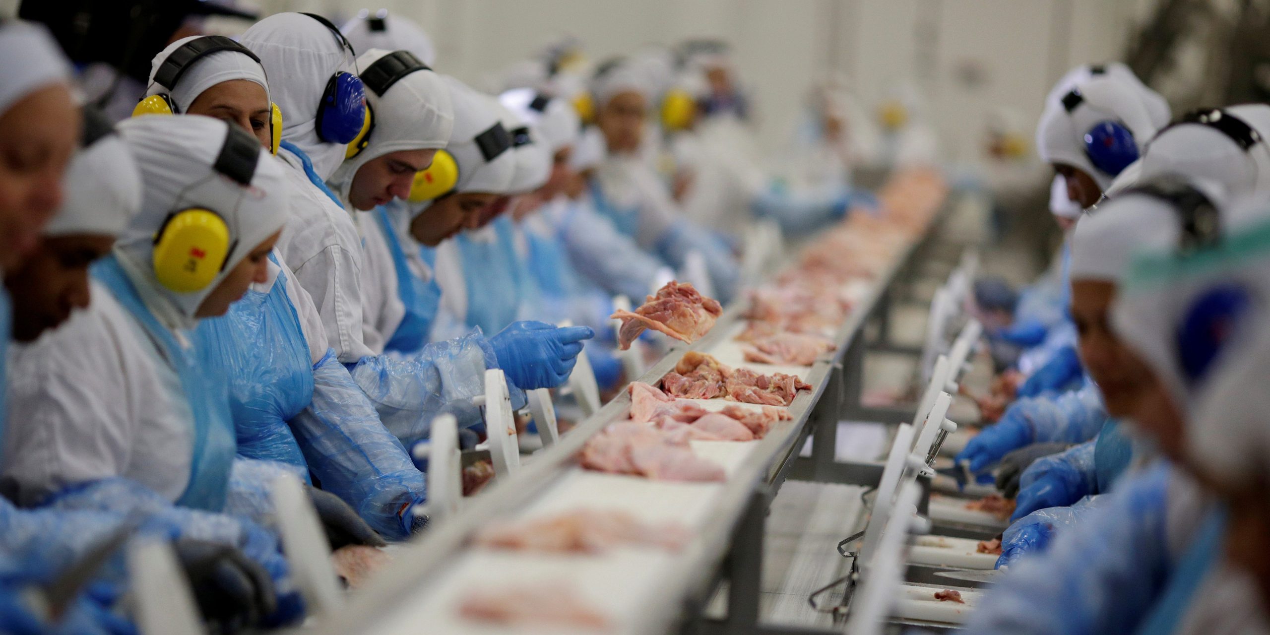 FILE PHOTO: Employees are seen during a technical visit of Brazil's Agriculture Minister Blairo Maggi at the Brazilian meatpacker JBS SA in the city of Lapa, Parana state, Brazil, March 21, 2017. REUTERS/Ueslei Marcelino/File Photo