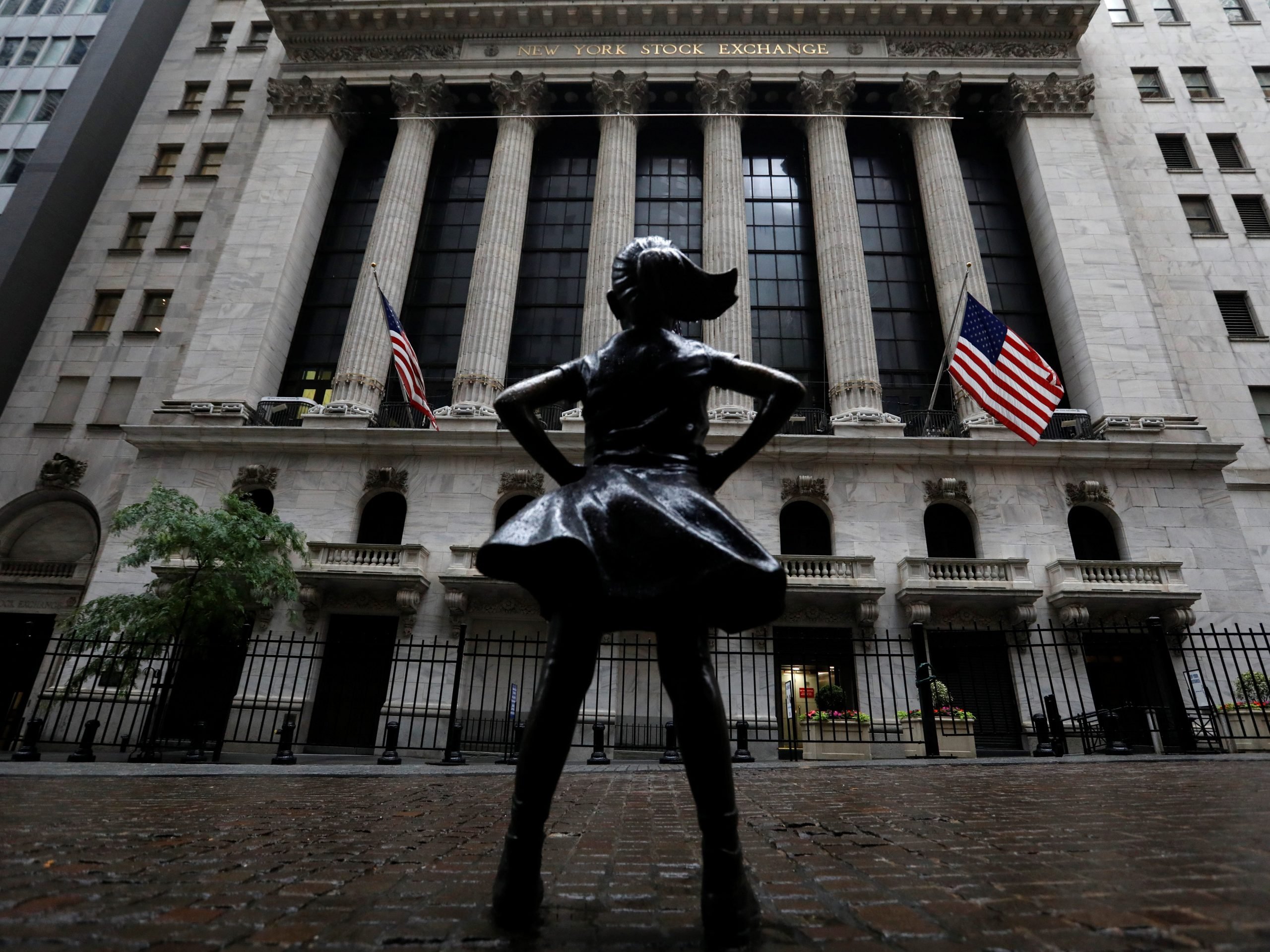 FILE PHOTO: The Fearless Girl statue is seen outside the New York Stock Exchange (NYSE) in New York City, New York, U.S., June 11, 2020. REUTERS/Brendan McDermid