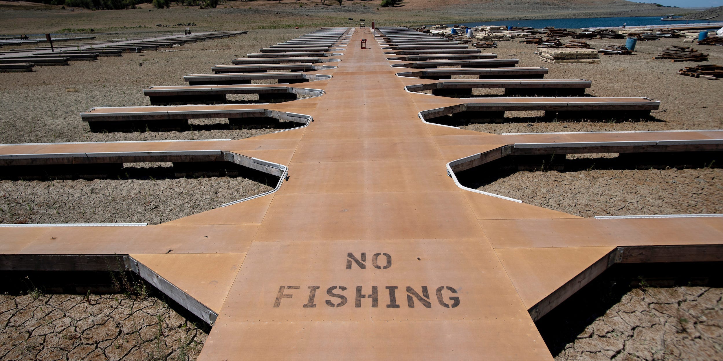 Empty boat docks sit on dry land at the Browns Ravine Cove area of drought-stricken Folsom Lake, currently at 37% of its normal capacity, in Folsom, Calif., Saturday, May 22, 2021.