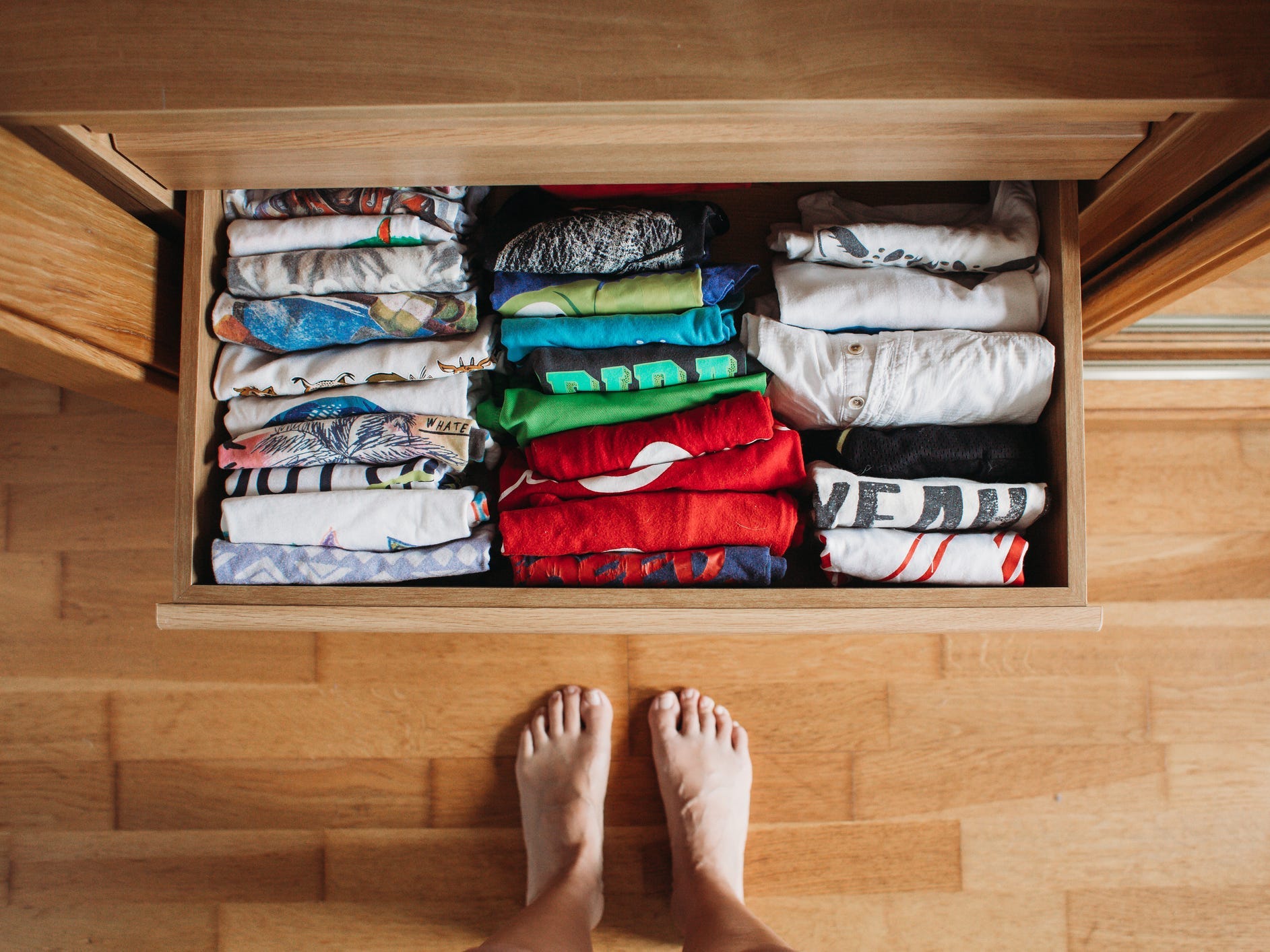 A drawer full of neatly folded tshirts