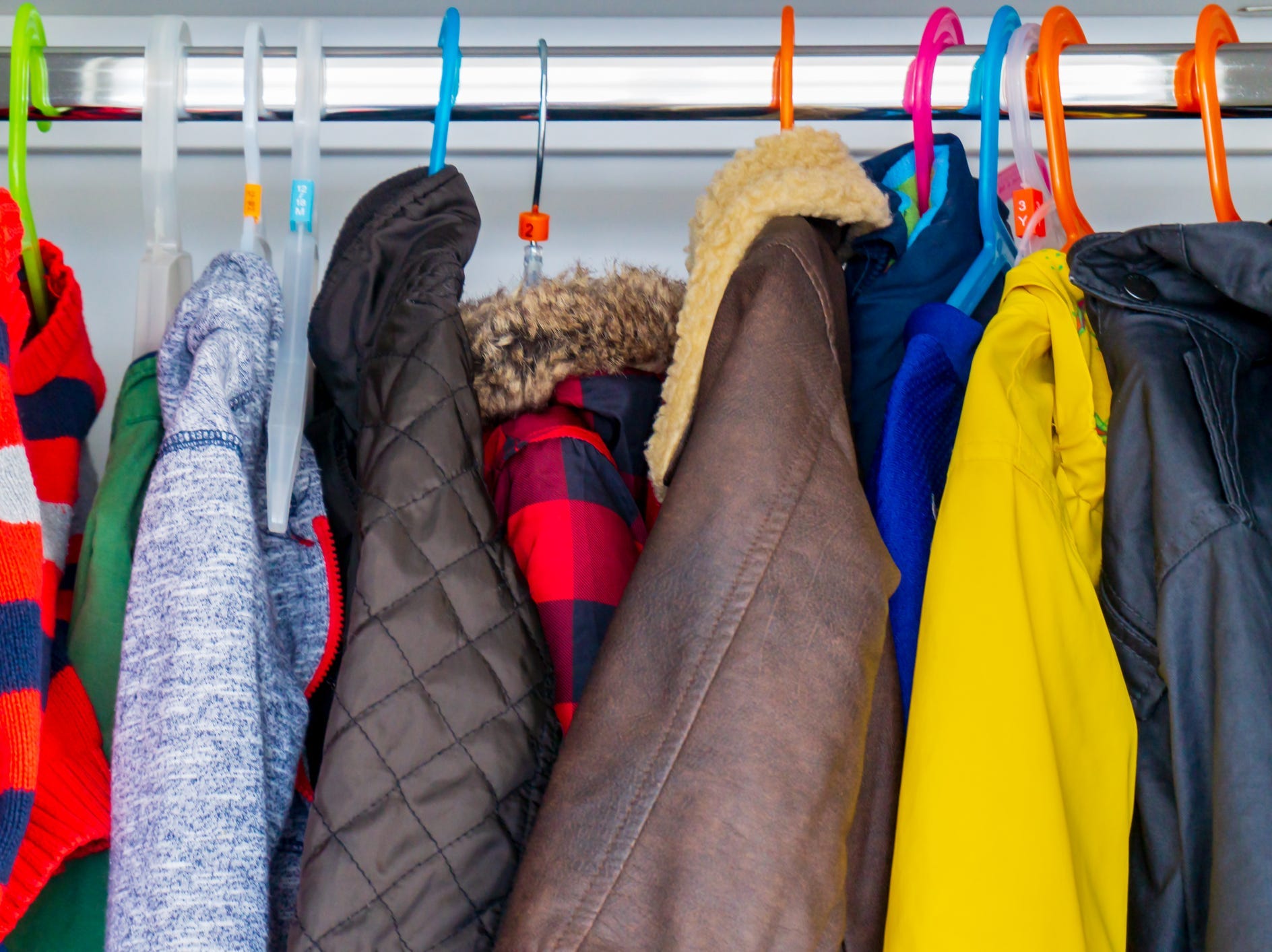 Coats hanging in a closet