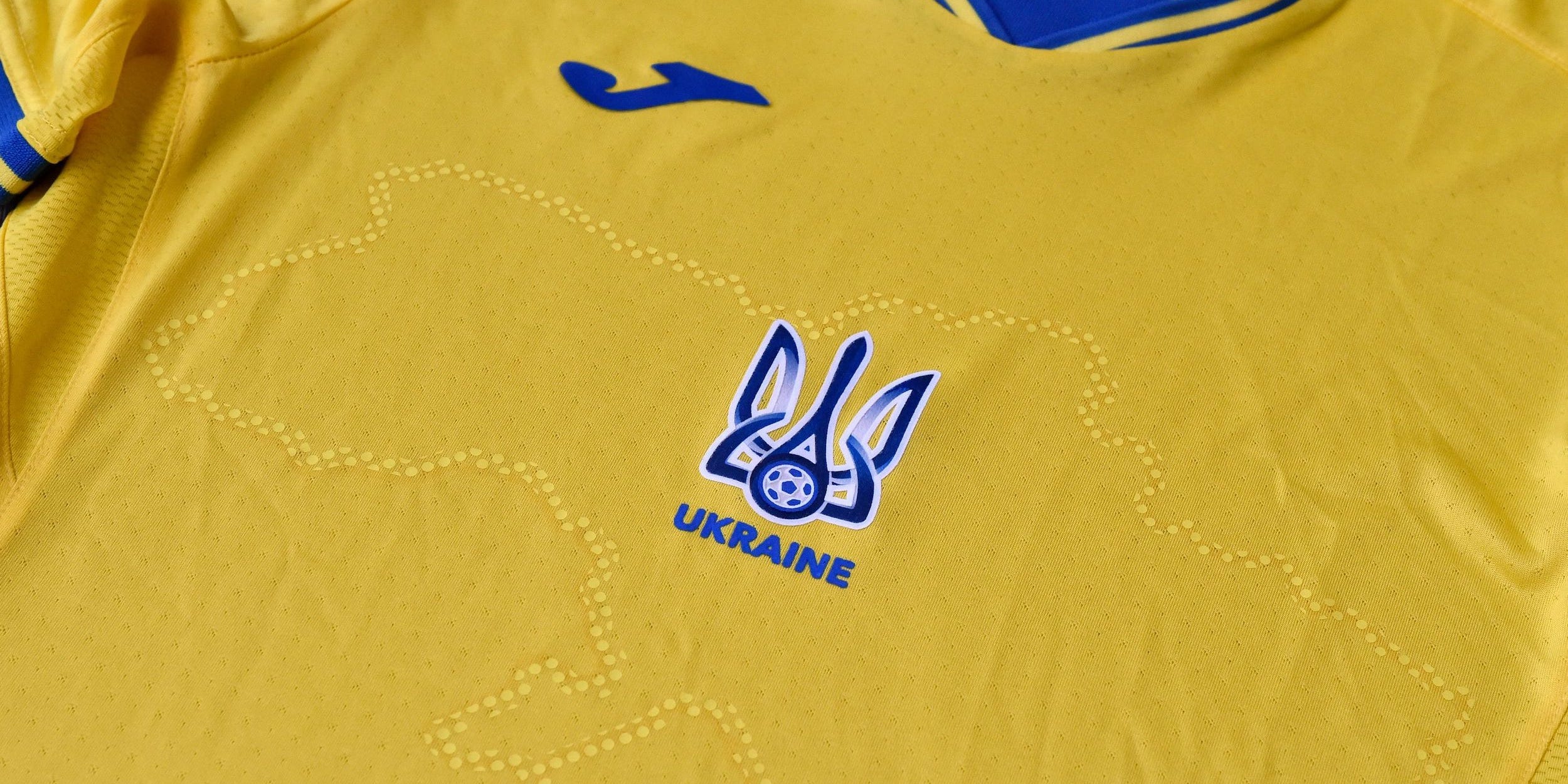 A picture taken on June 6, 2021 shows a EURO 2020 jersey of the Ukrainian national football team. - Ukraine provoked Moscow's ire on June 6, 2021 as its football federation unveiled Euro 2020 uniforms that feature Russian-annexed Crimea and nationalist slogans.