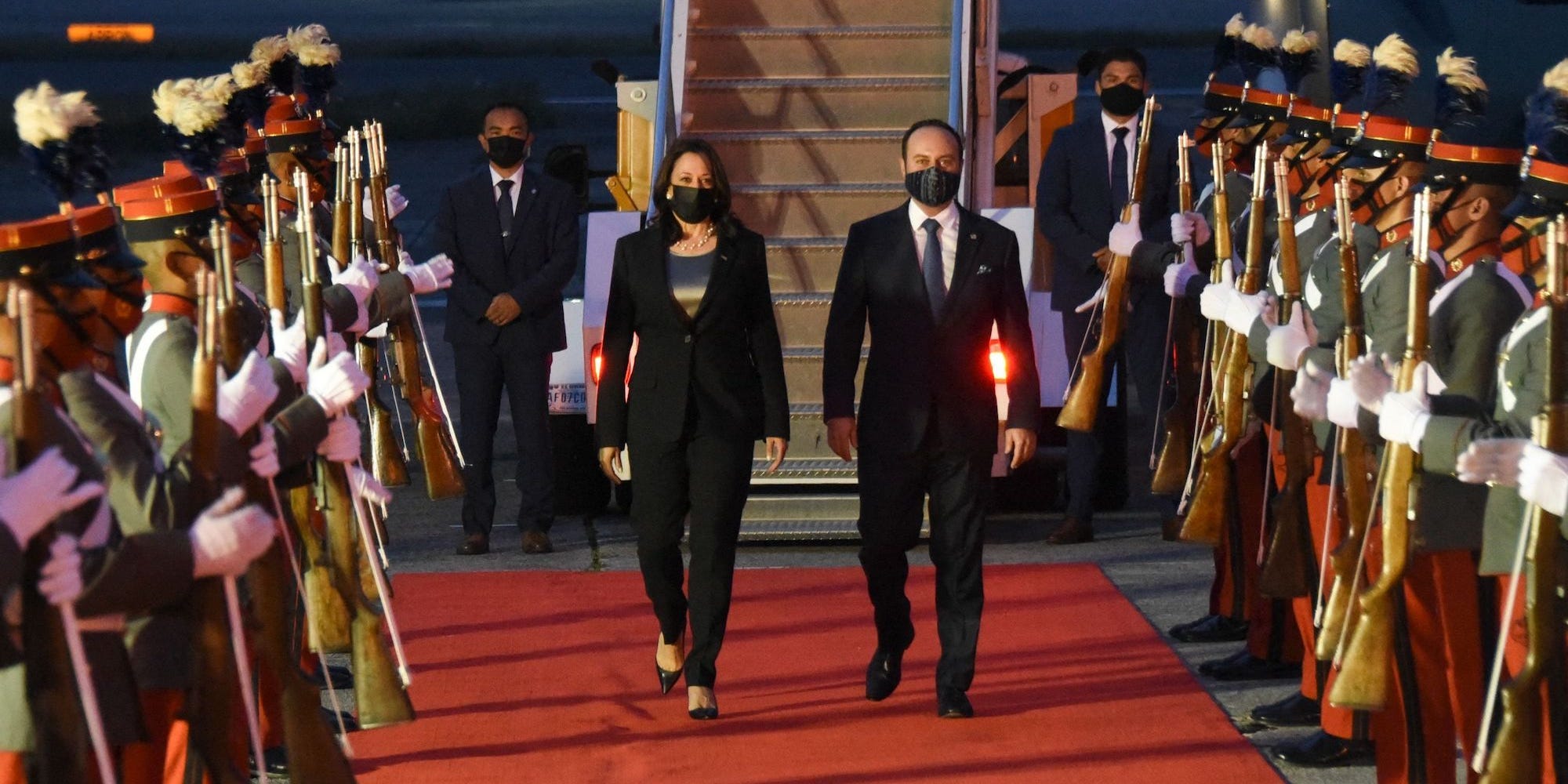 US Vice President Kamala Harris walks alongside Guatemalan Foreign Minister Pedro Brolo upon her arrival at the Air Force Base in Guatemala City, on June 6, 2021.