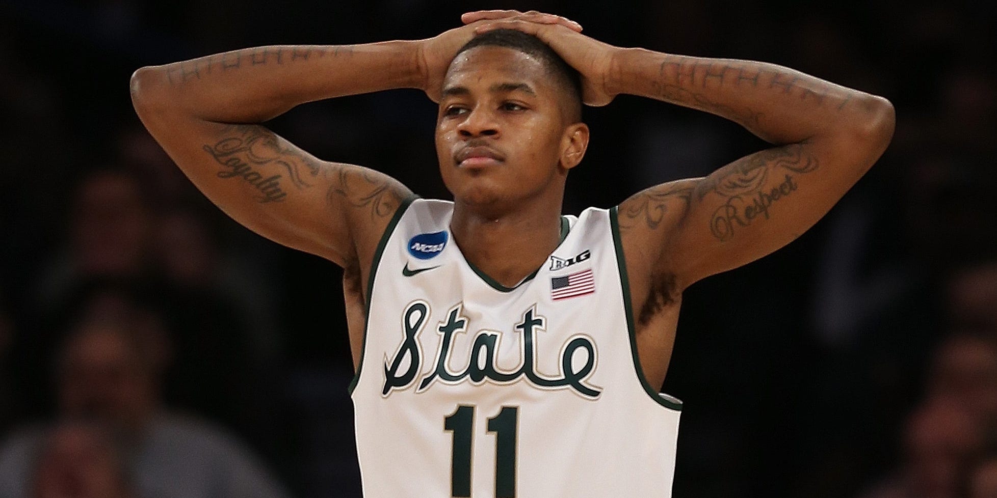 Keith Appling #11 of the Michigan State Spartans reacts against the Connecticut Huskies during the East Regional Final of the 2014 NCAA Men's Basketball Tournament at Madison Square Garden on March 30, 2014 in New York City.