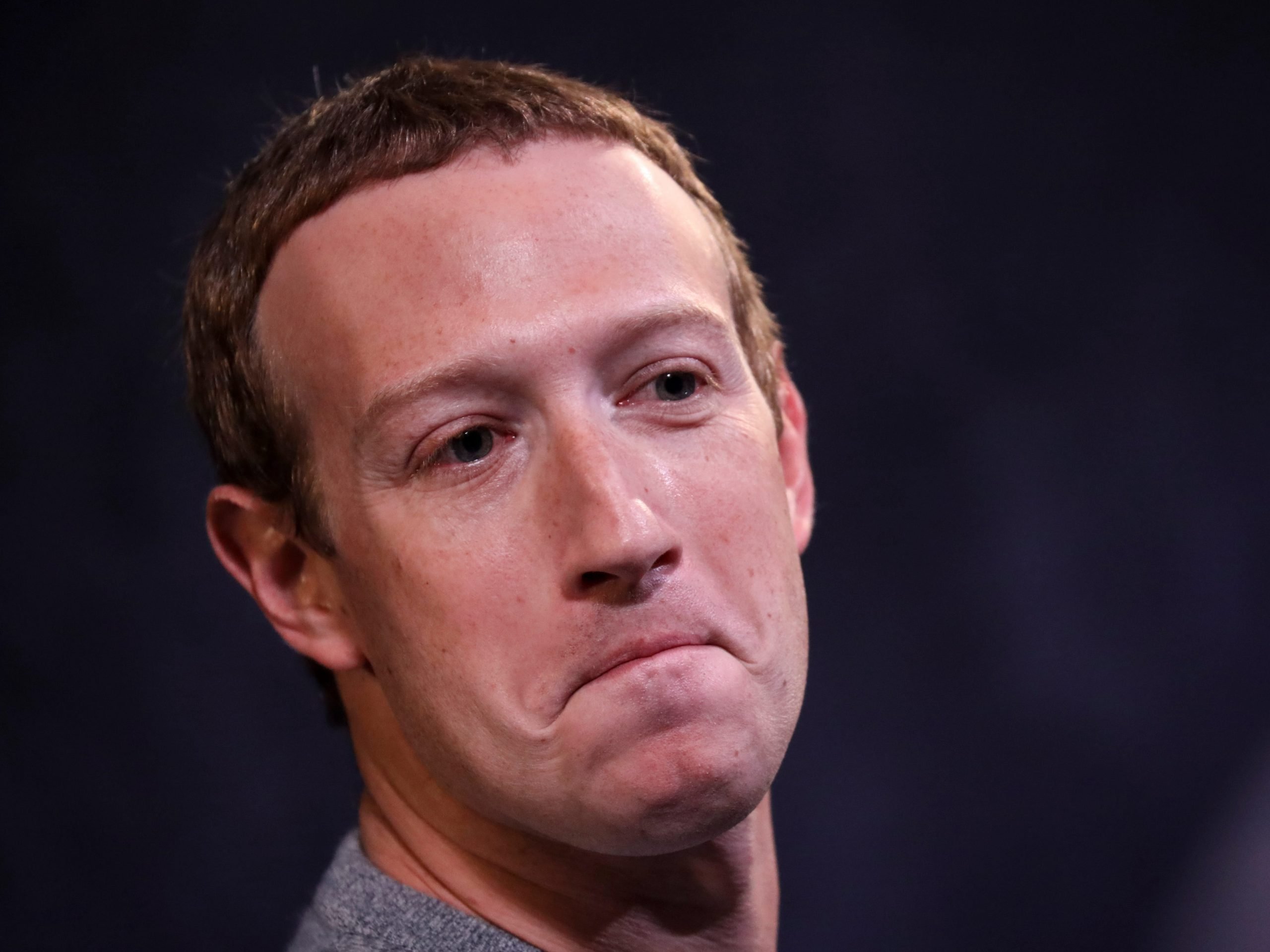 Close-up shot of Mark Zuckerberg with a frown.