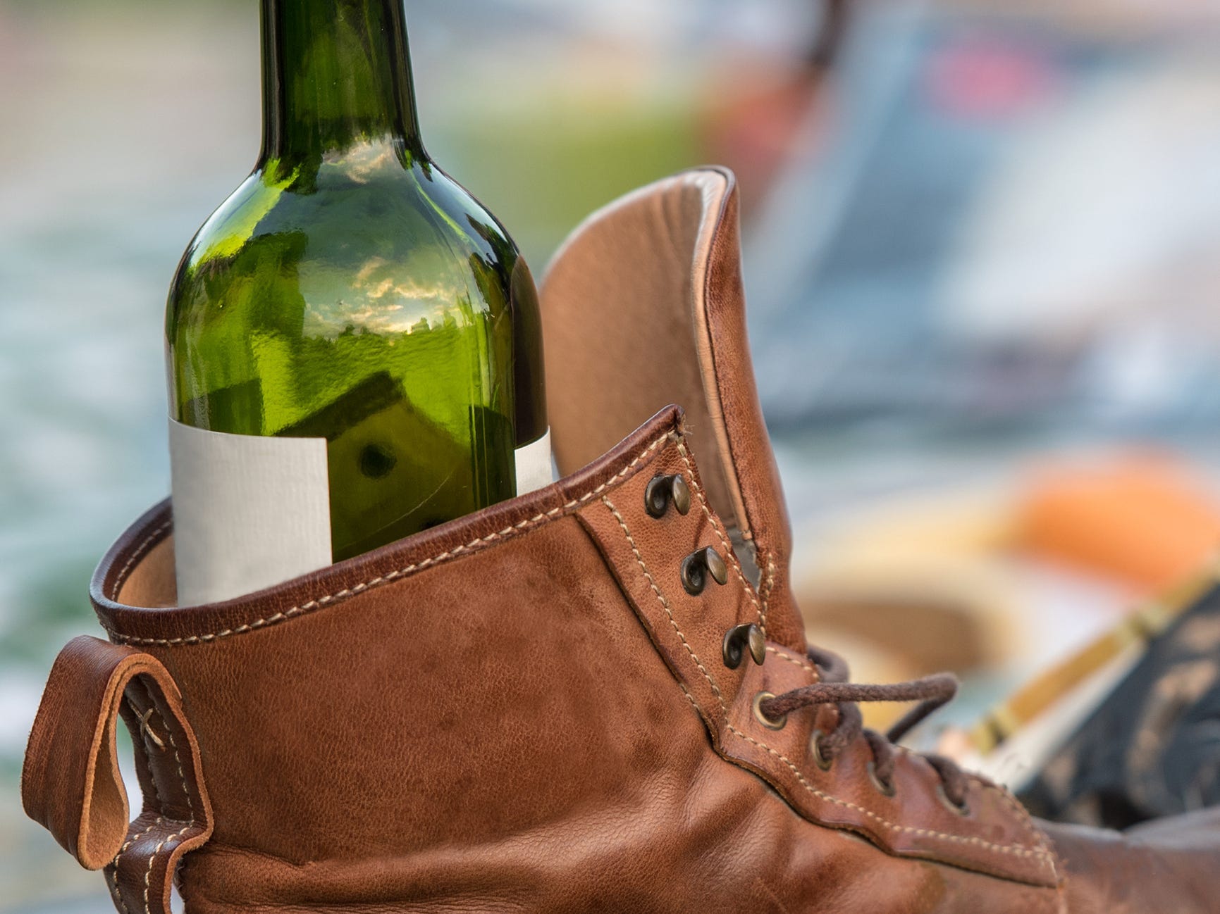 A wine bottle inside a boot