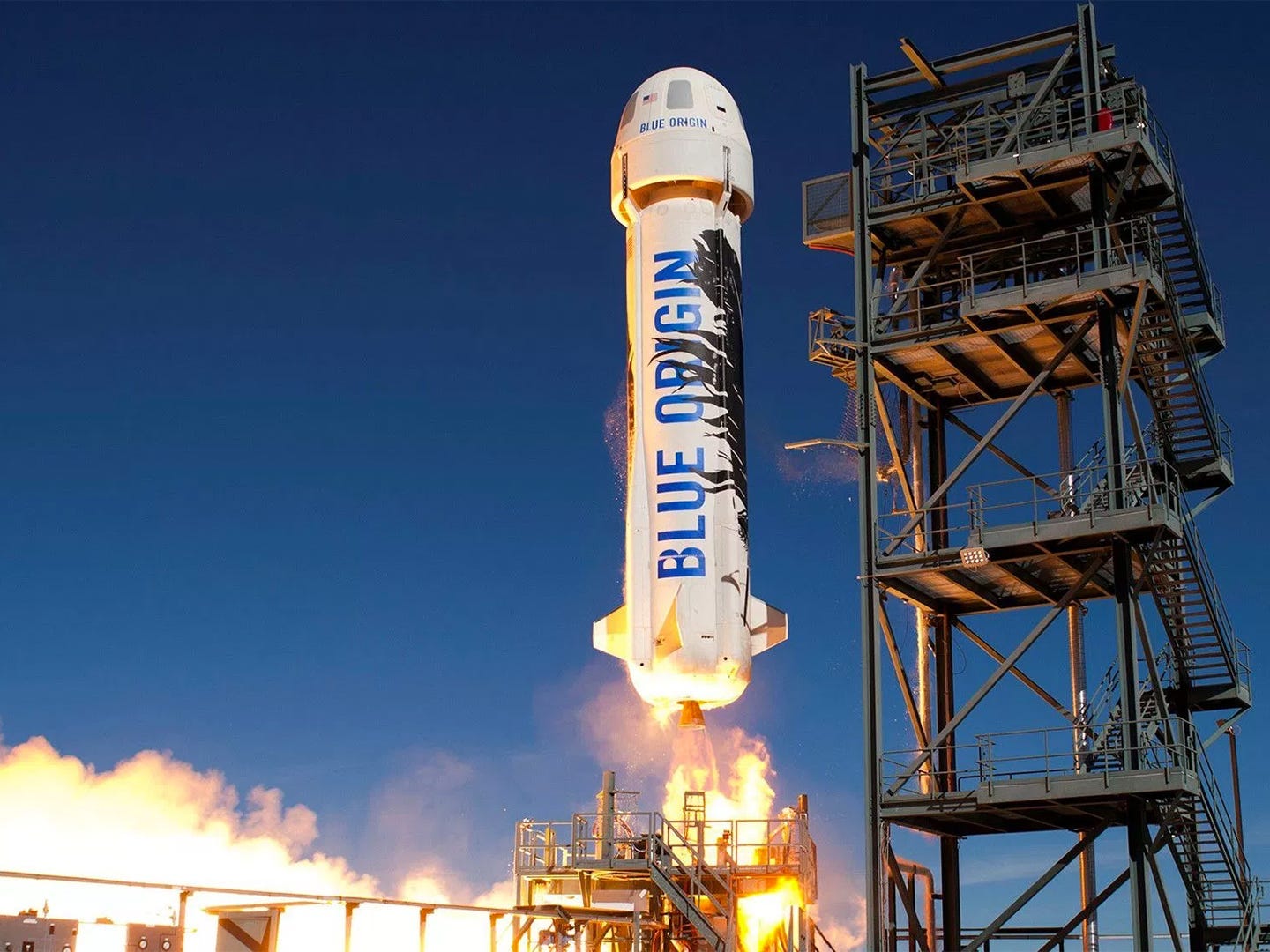 Blue Origin's reusable New Shepard suborbital rocket launches toward space in 2016.