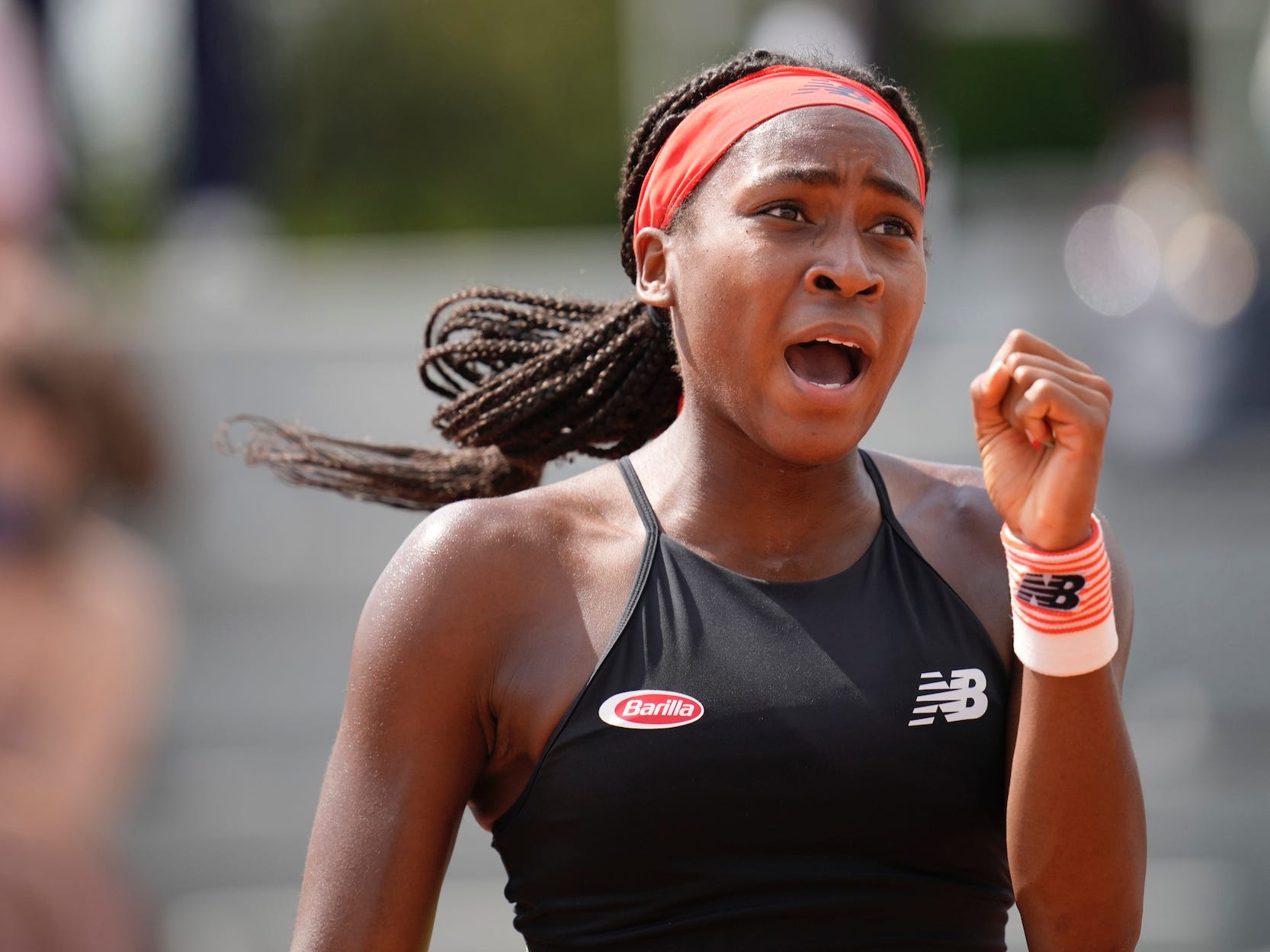 Coco Gauff celebrates at the French Open.