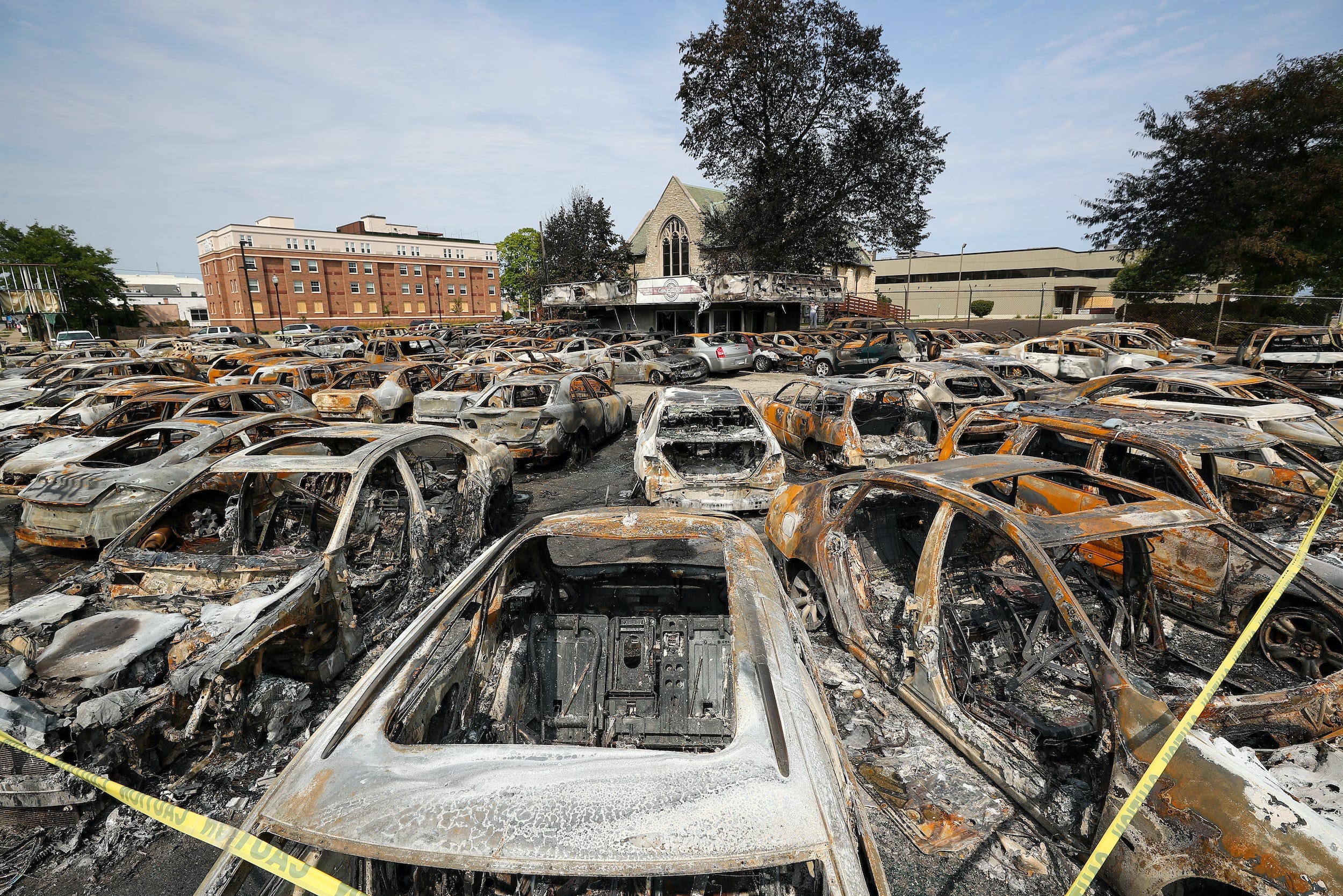 burned cars at a dealership in kenosha that was hit by riots