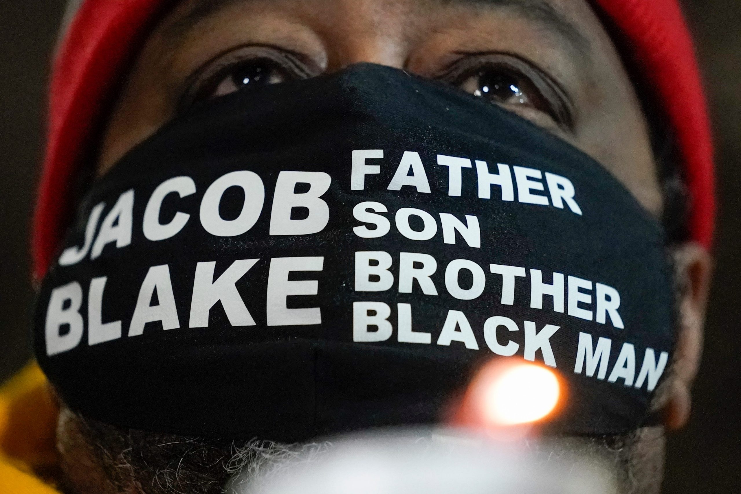 jacob blake sr wears a mask that says jacob blake father son brother black man