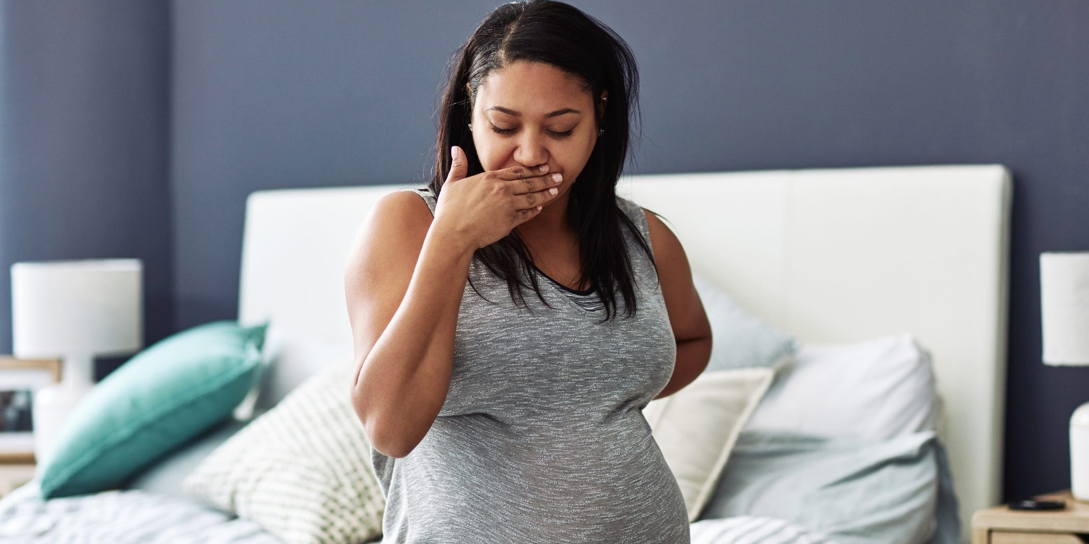 woman nauseous while pregnant