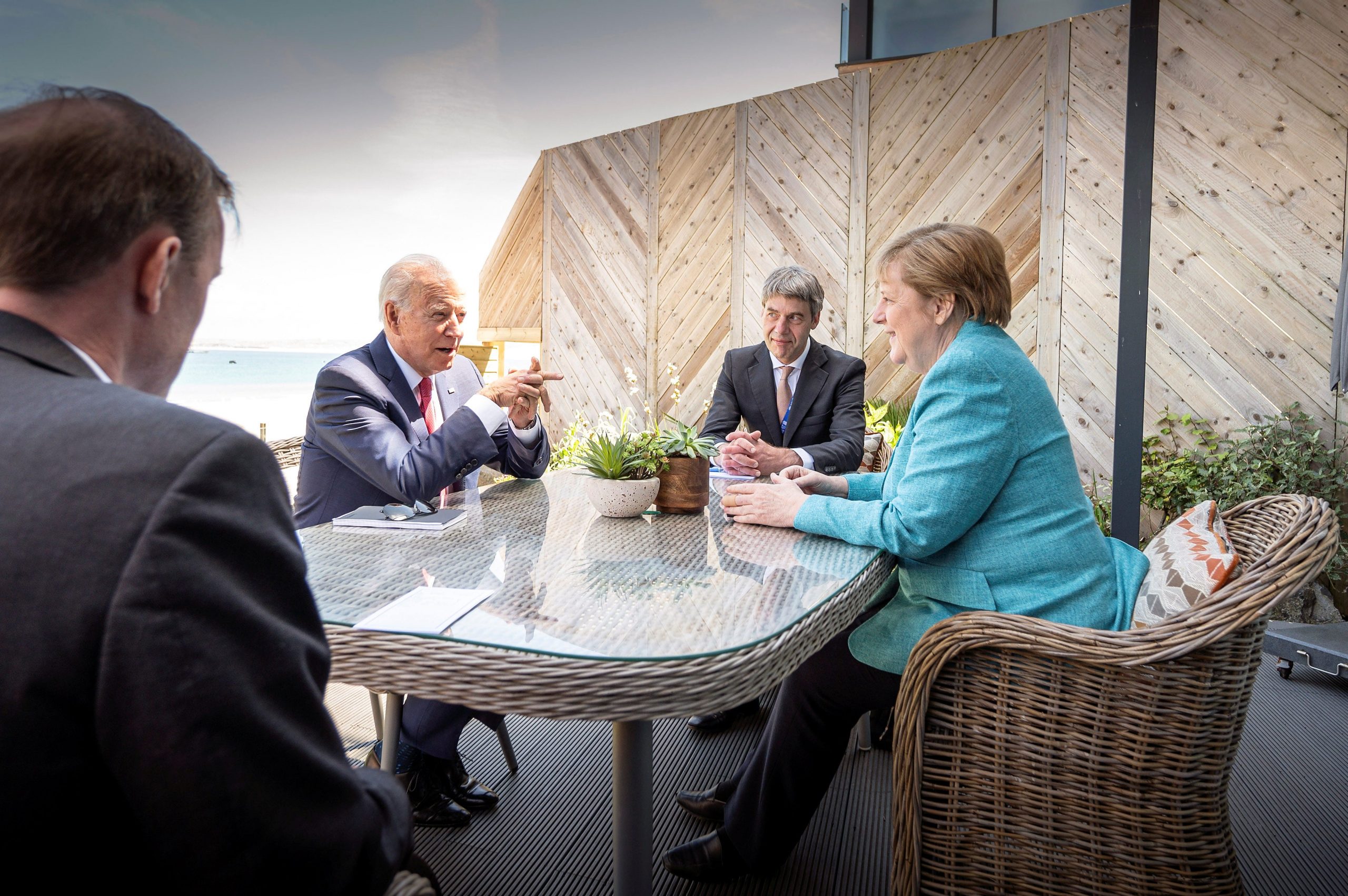 President Joe Biden and German Chancellor Angela Merkel talk with in England.