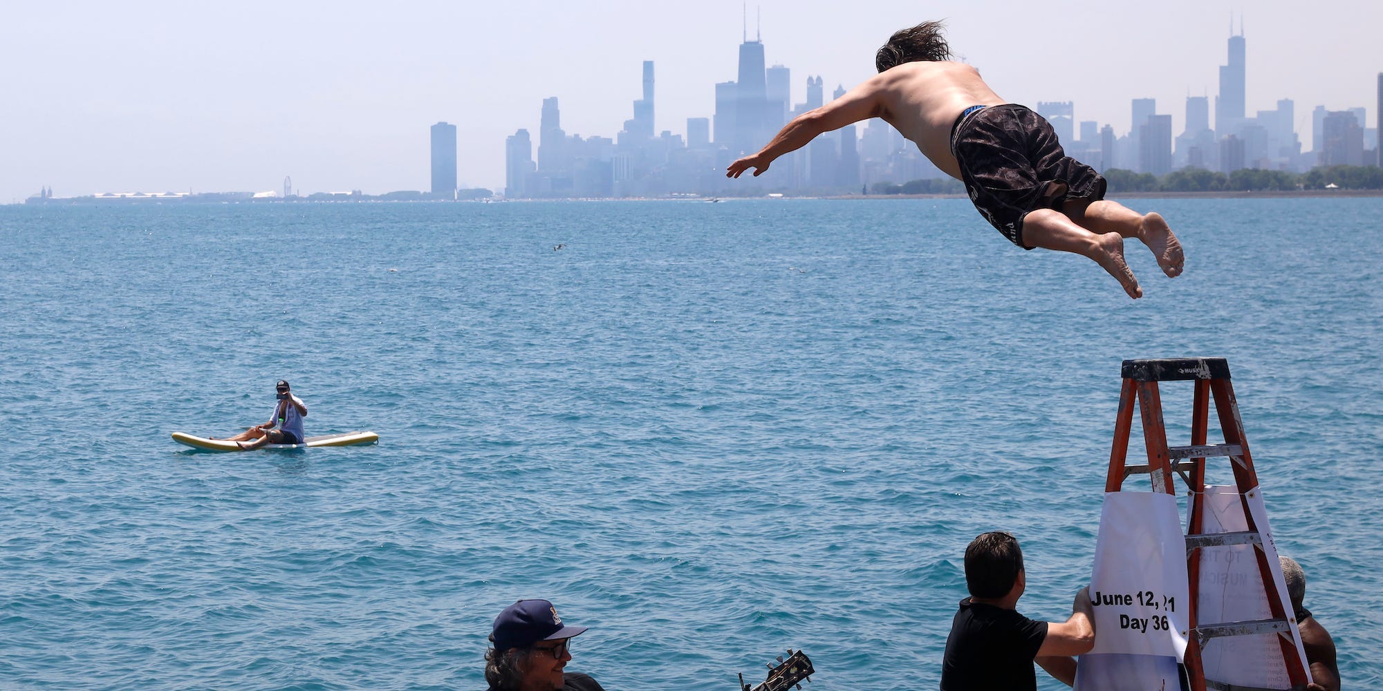 Dan O'Conor, the "Great Lake Jumper," makes his 365th leap into Lake Michigan, Saturday, June 12, 2021, in Chicago's Montrose Point.