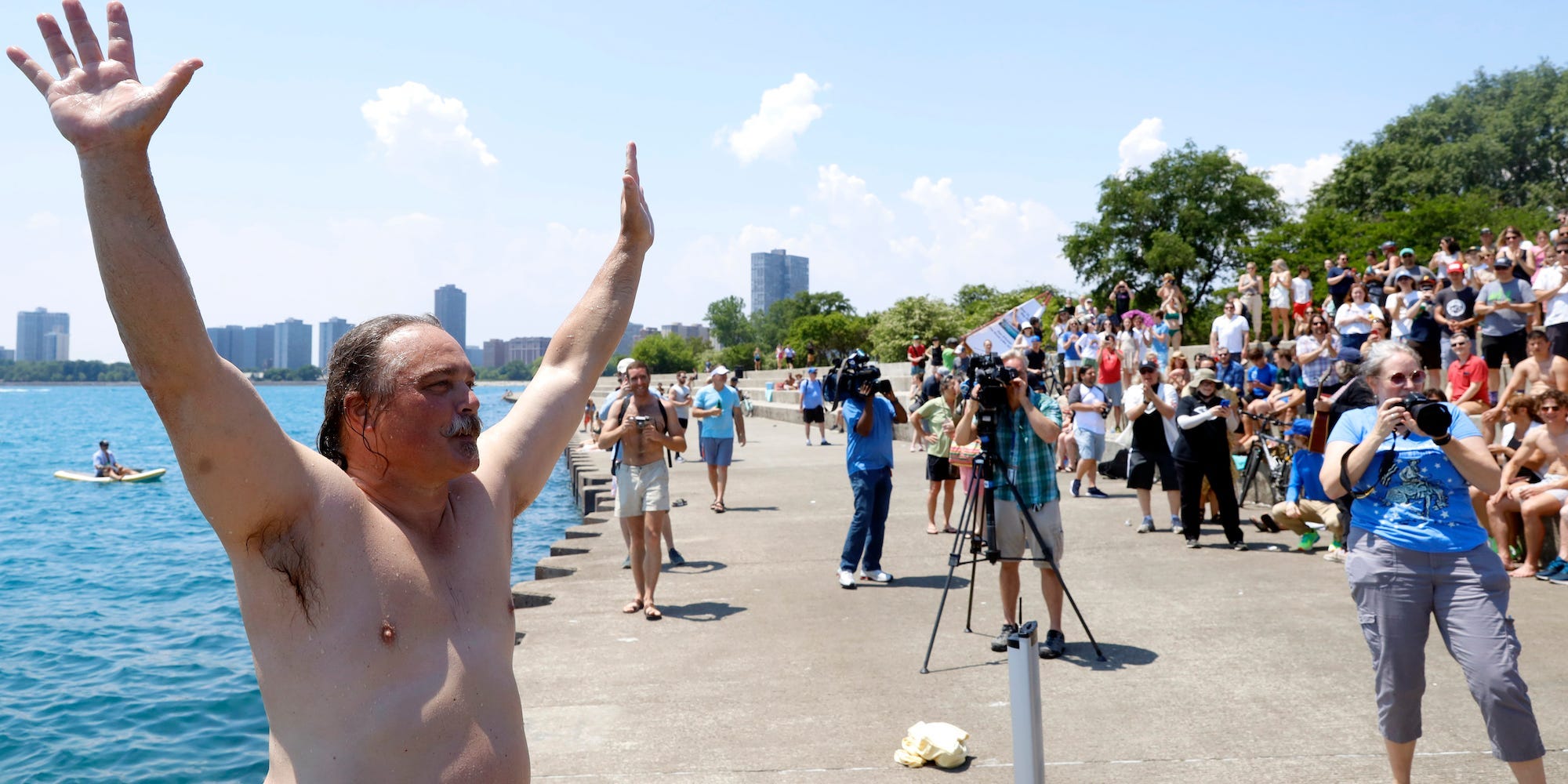 Dan O'Conor, the "Great Lake Jumper," with his arms up
