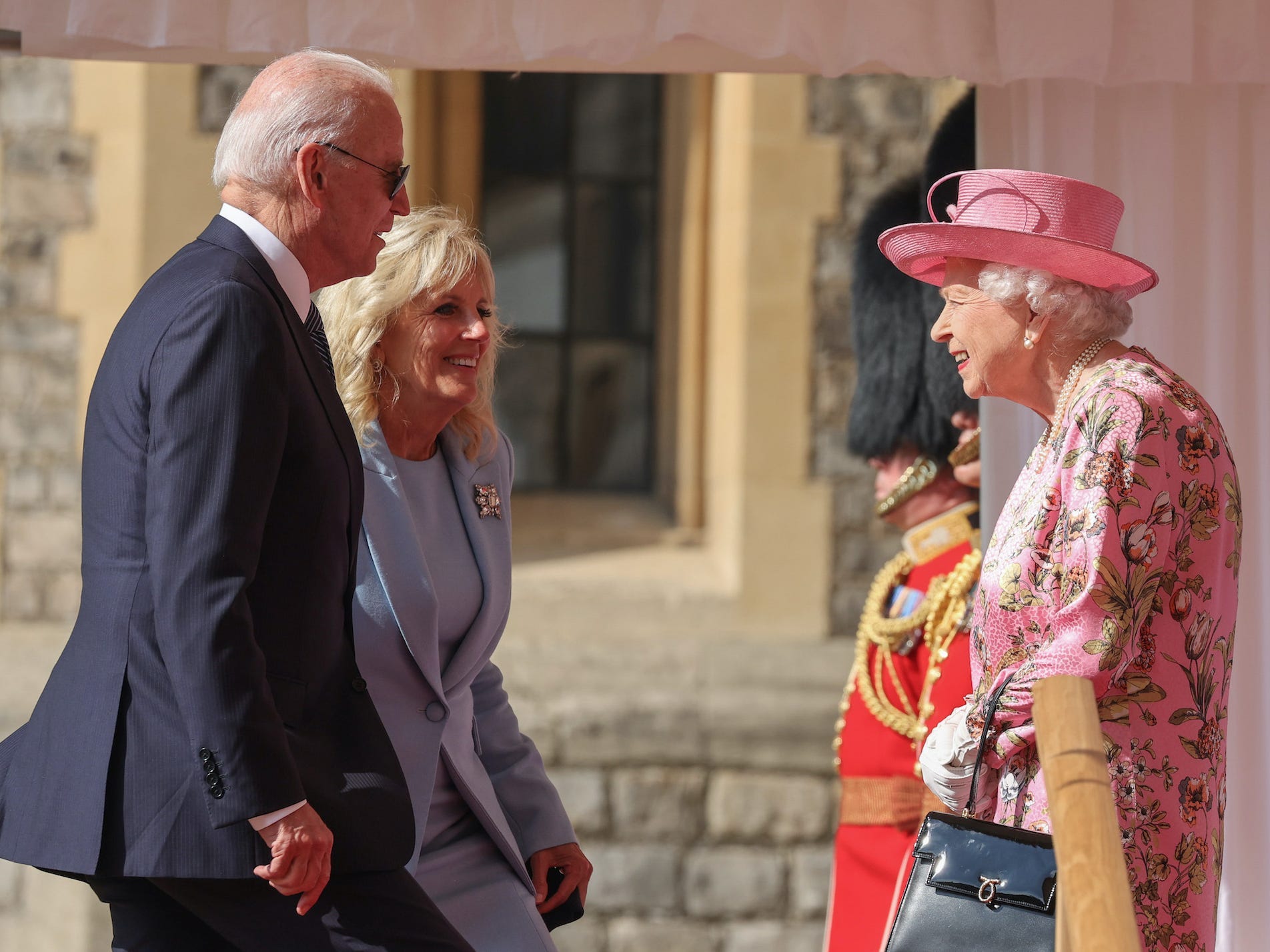 President Joe Biden and first lady Jill Biden talk with Queen Elizabeth at Windsor Castle.