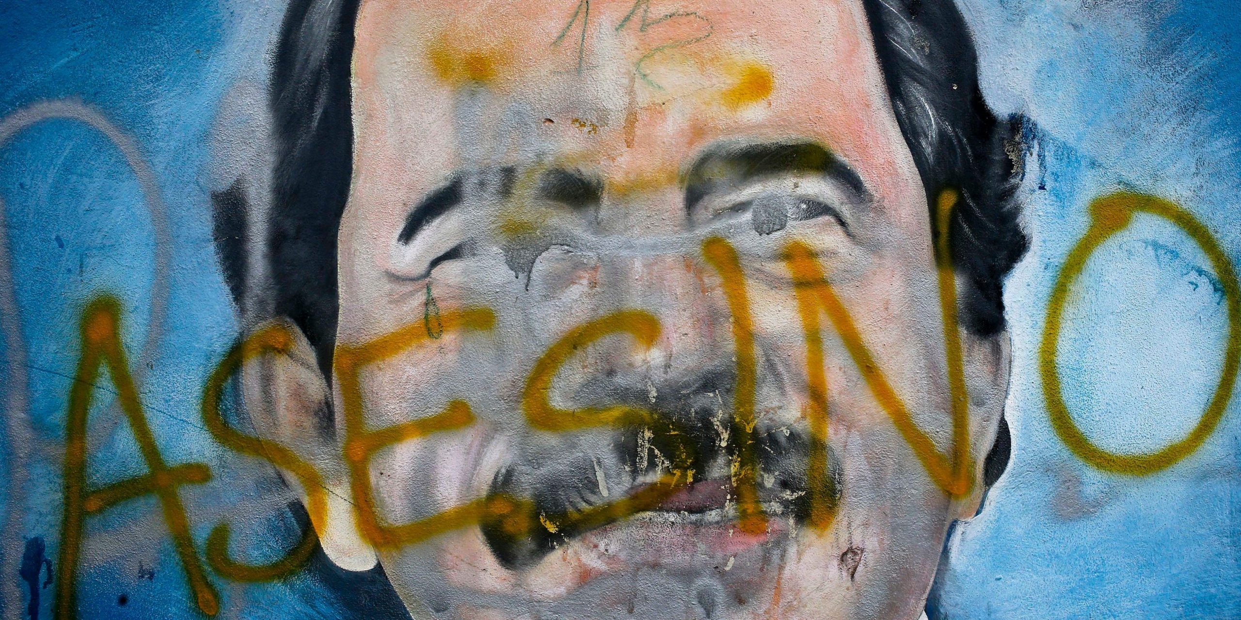 A portrait of Nicaraguan president Daniel Ortega with the word "asesino" written on top.