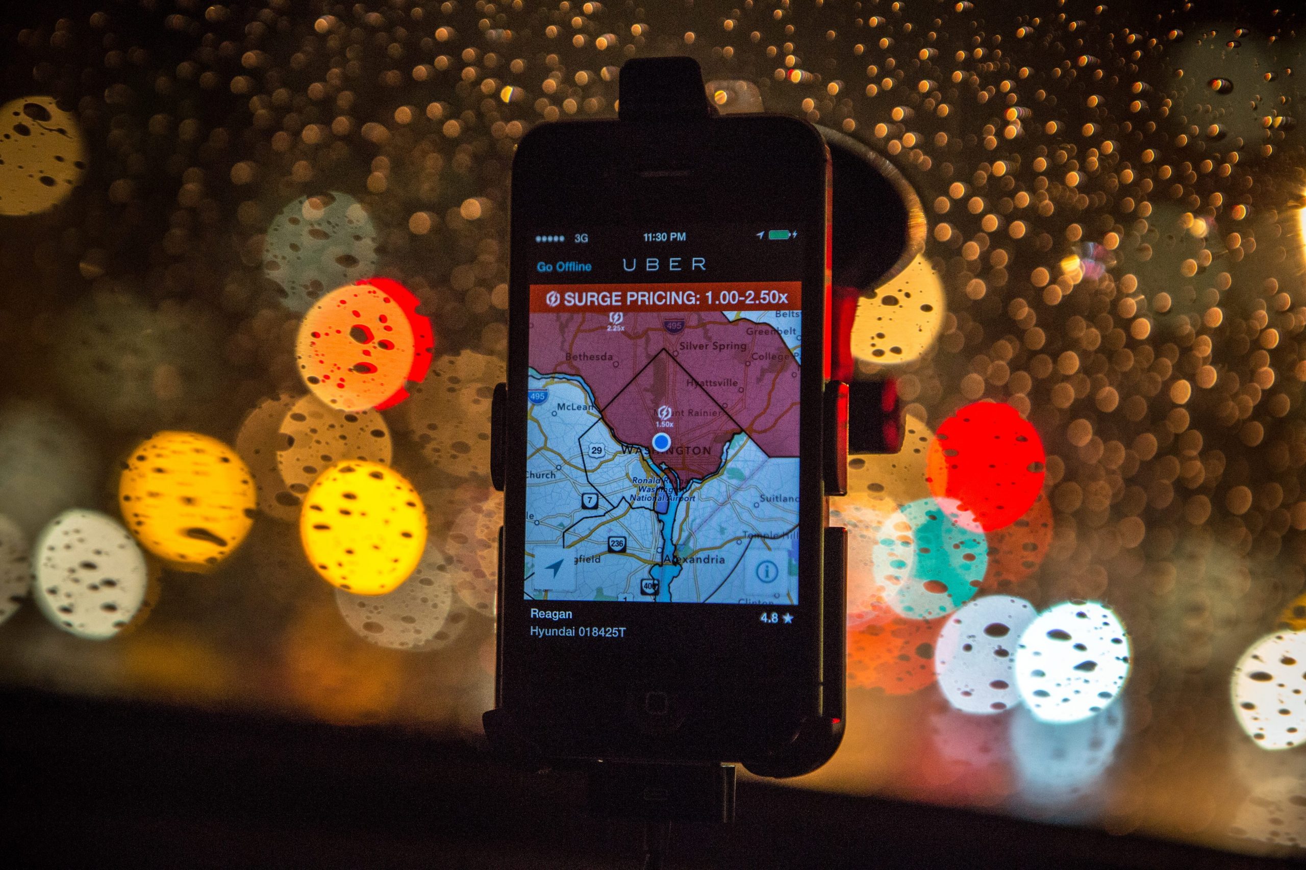 The Uber driver app is shown on the phone of UberX driver Regan Rucker, indicating surge pricing during peak ridership on Friday night, April 4, 2014, in Washington, DC.