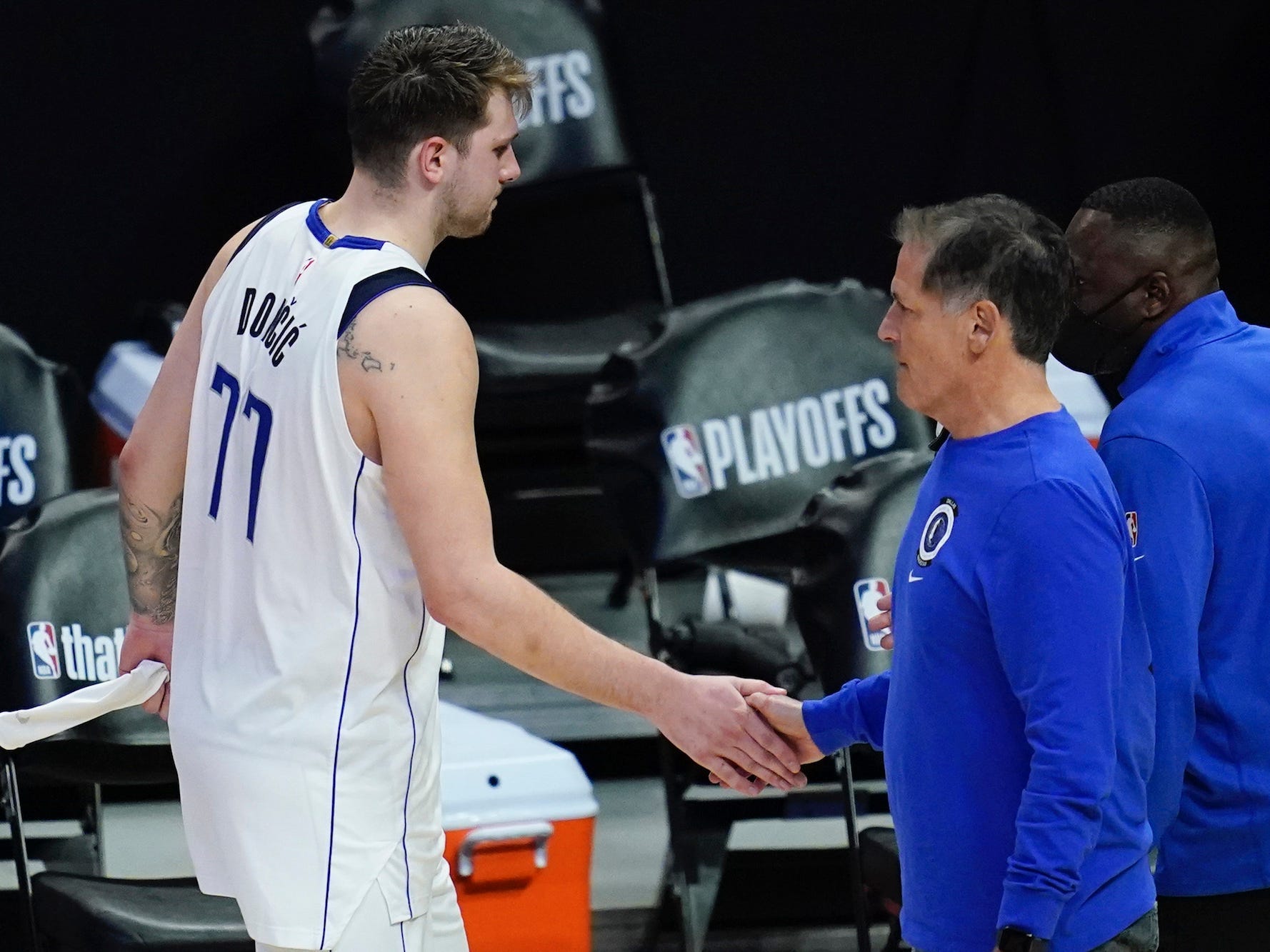 Luka Doncic high-fives Mavs owner Mark Cuban