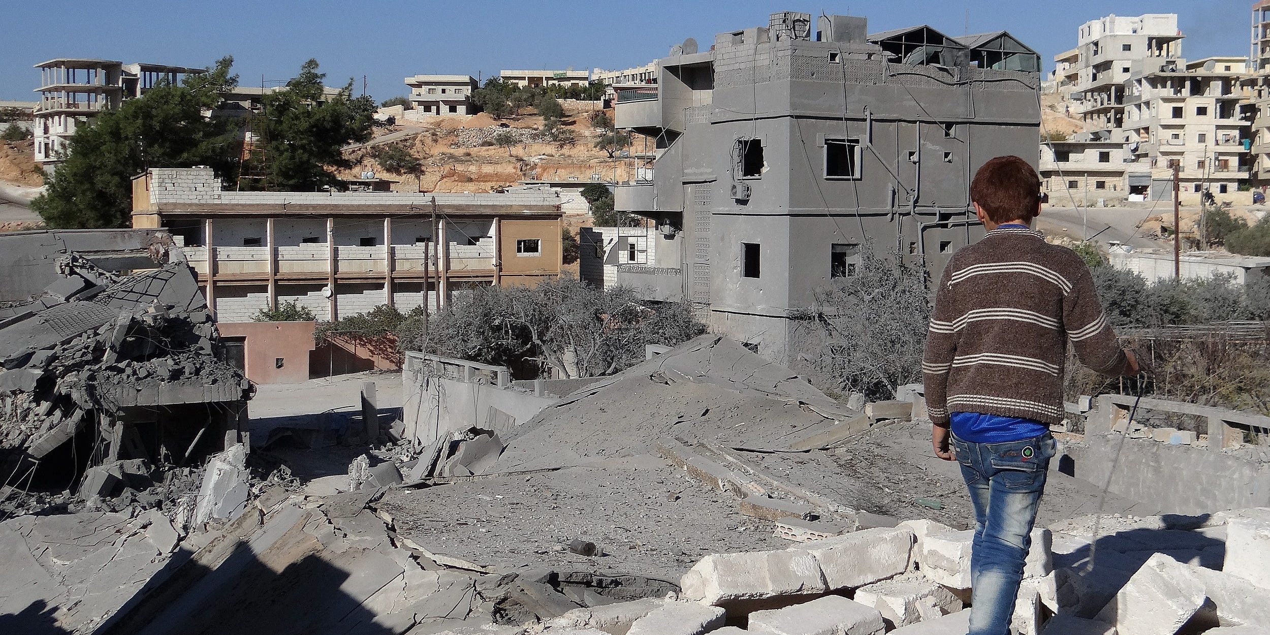 Debris are seen following a US-led coalition airstrike hits Headquarters of al Nusra Front in Aleppo, Syria on November 06, 2014.