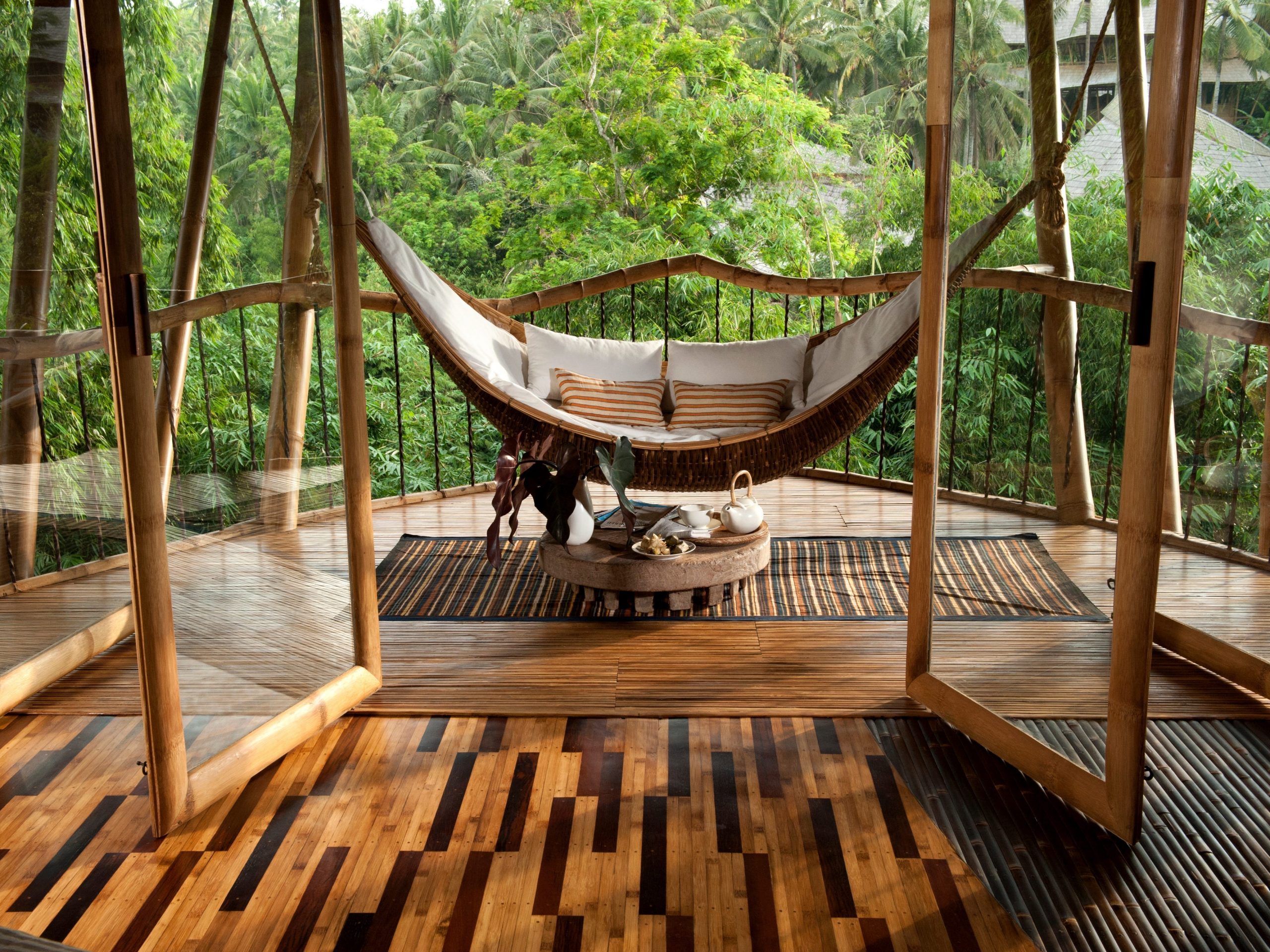 An Ibuku living space blends interior and exterior and included a hammock outside
