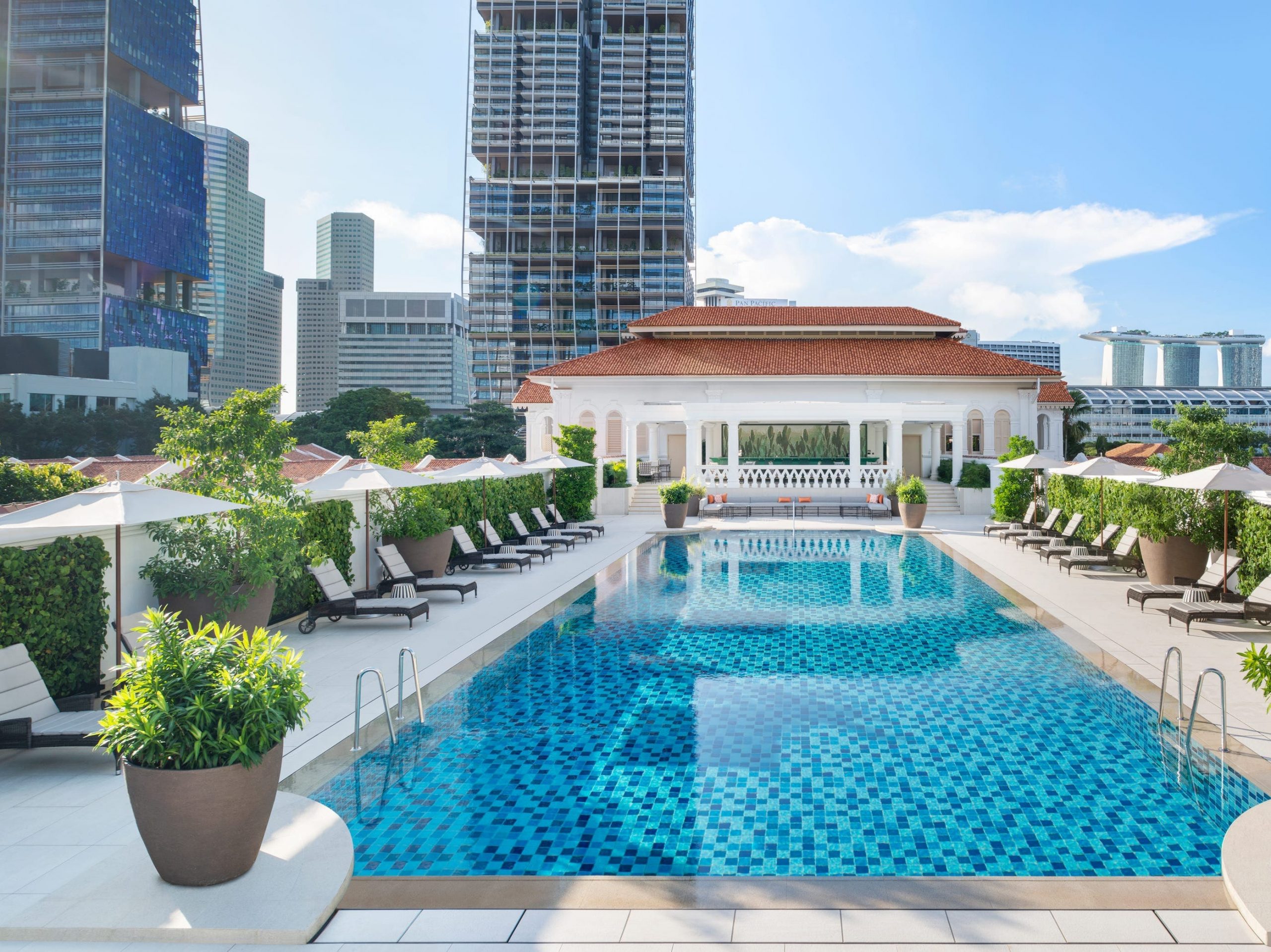 The outdoor swimming pool at Raffles Hotel, Singapore