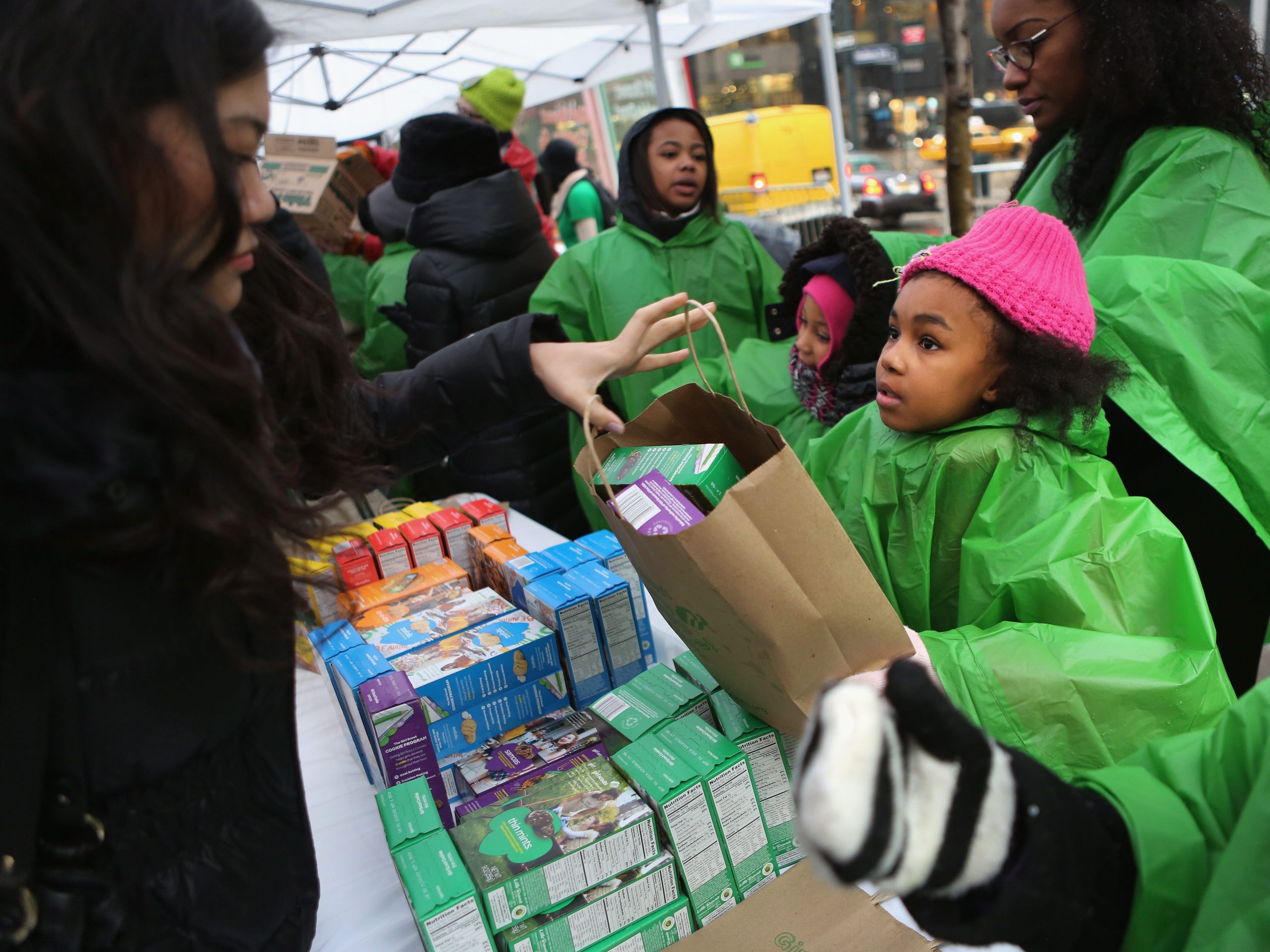 Girl Scouts sell cookies as a winter storm moves in on February 8, 2013 in New York City