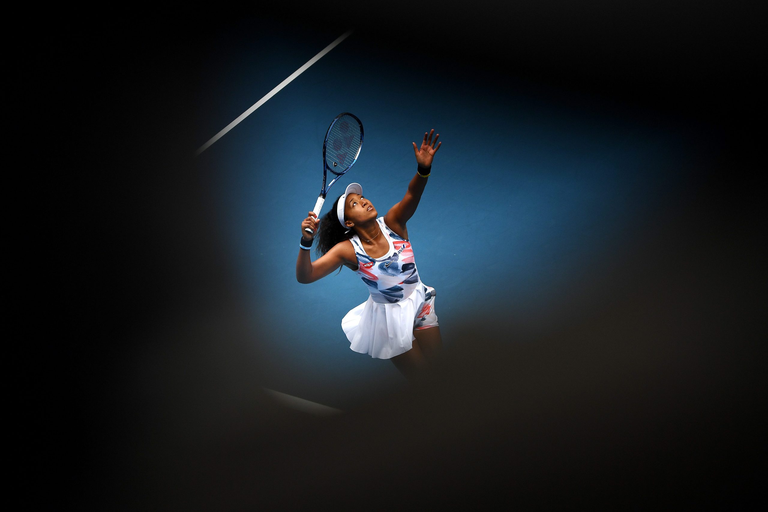 Naomi Osaka serves during a match at the 2020 Australian Open