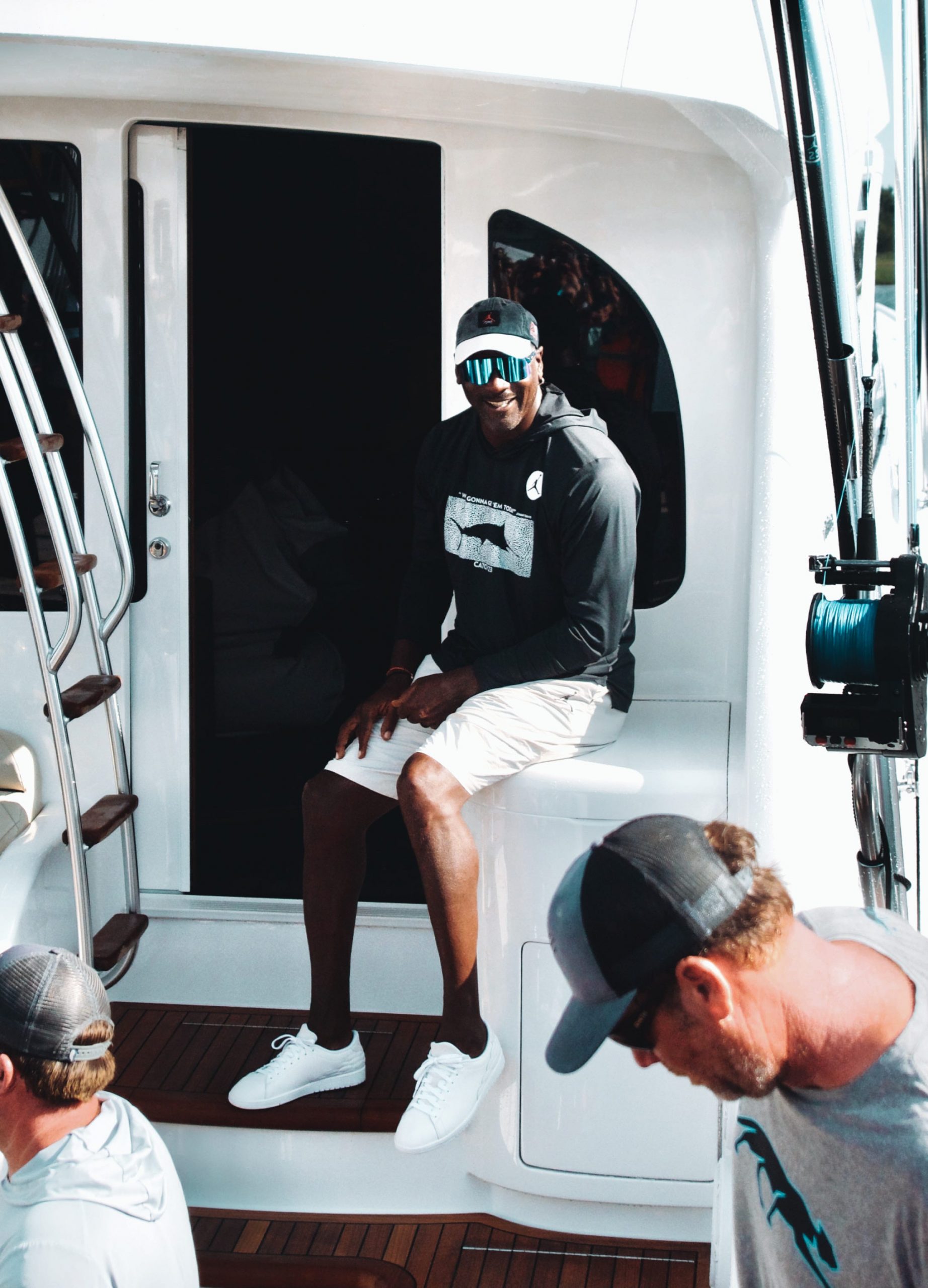 Michael Jordan sits on his boat, "Catch 23."