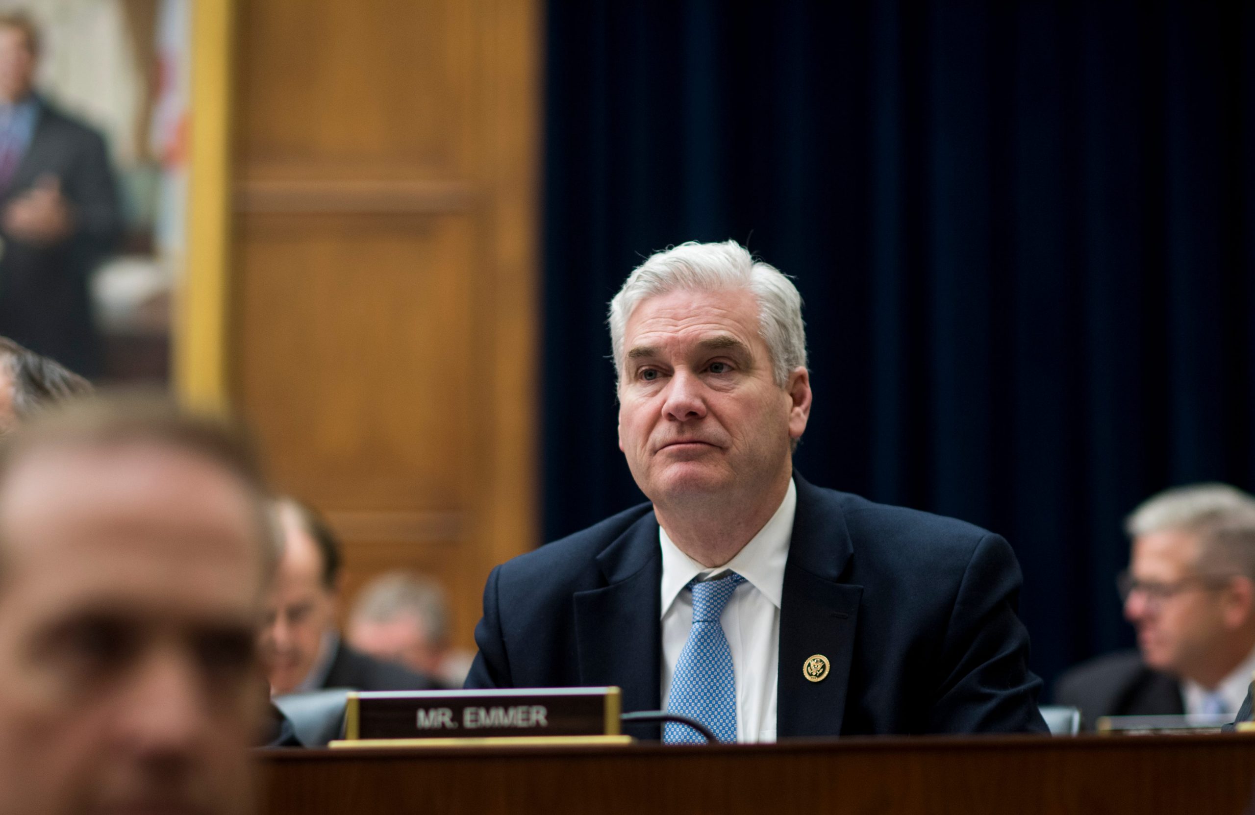 Representative Tom Emmer sitting down at the House Financial Services Committee meeting
