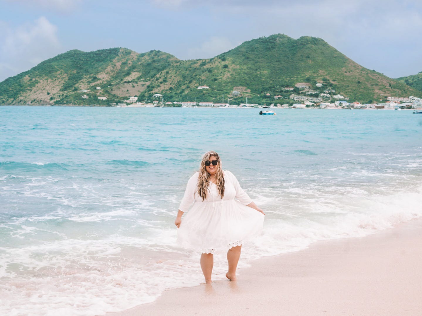 Halee Whiting on the beach in a white dress and sunglasses