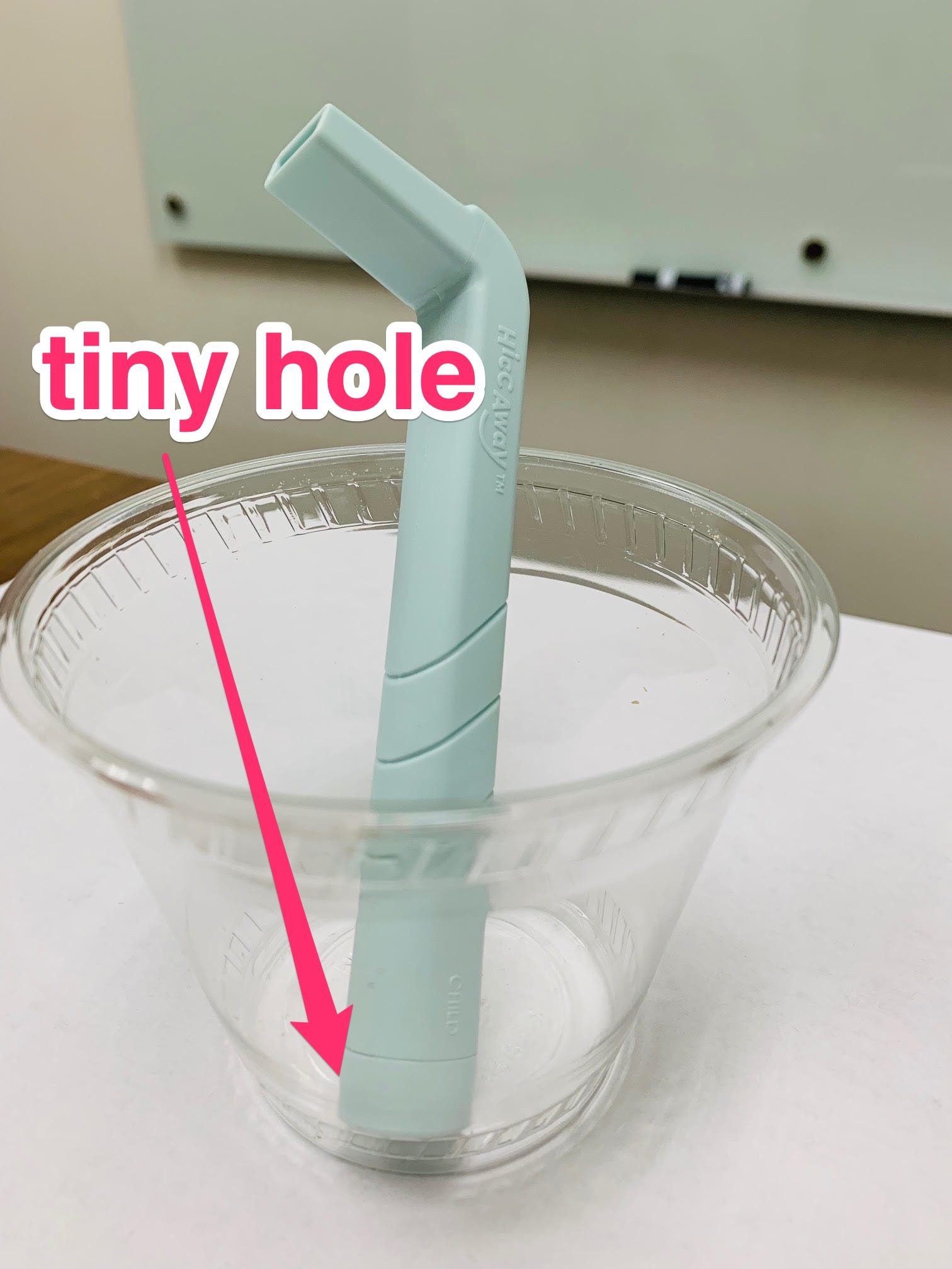 hiccaway thick straw for curing hiccups pictured in a cup