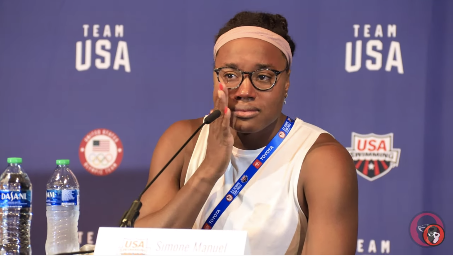 Simone Manuel wiping away tears at a press conference after she didn't qualify for the Olympic trials.