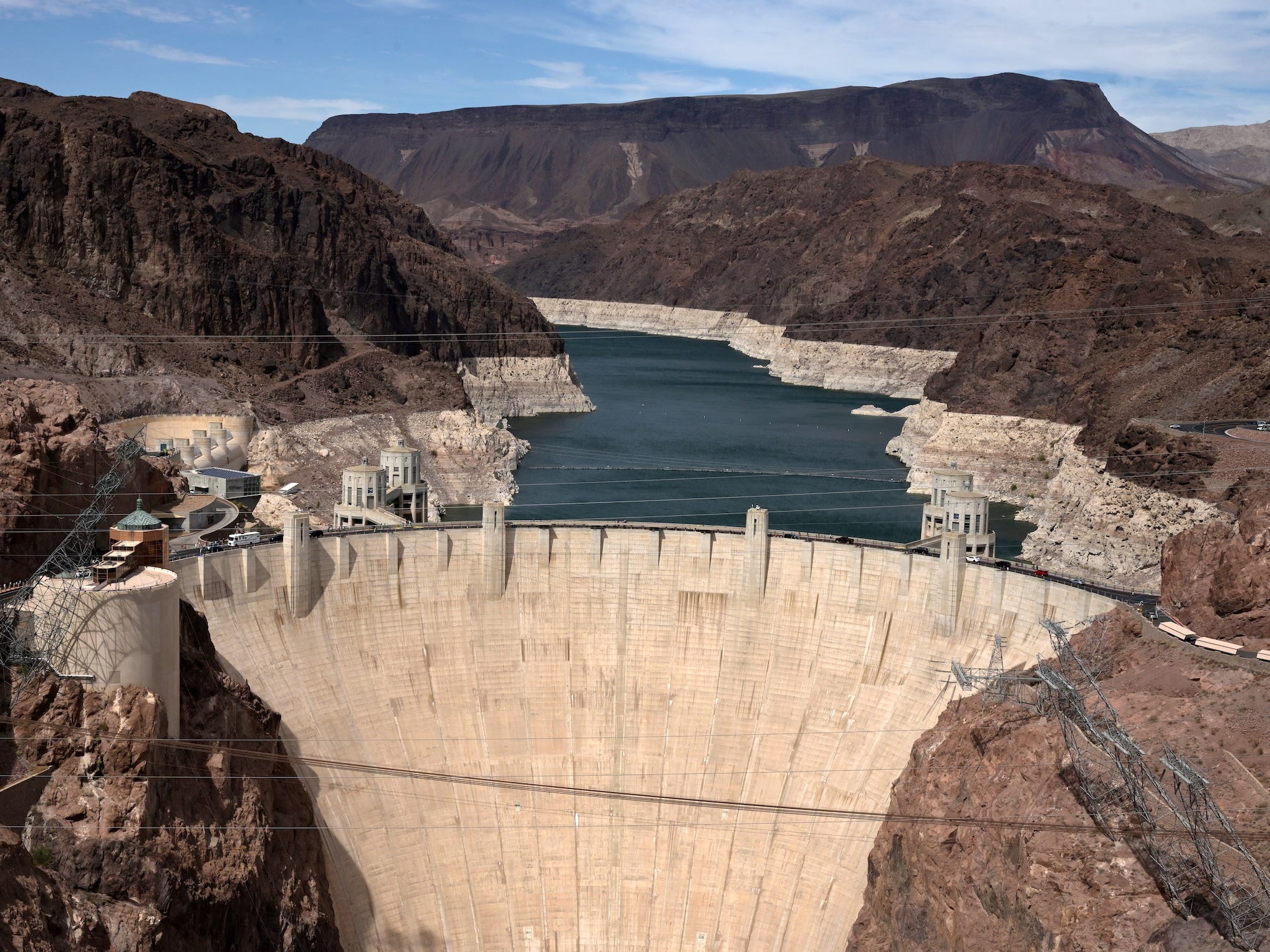 lake mead's low waters expose pale cliffs behind the hoover dam