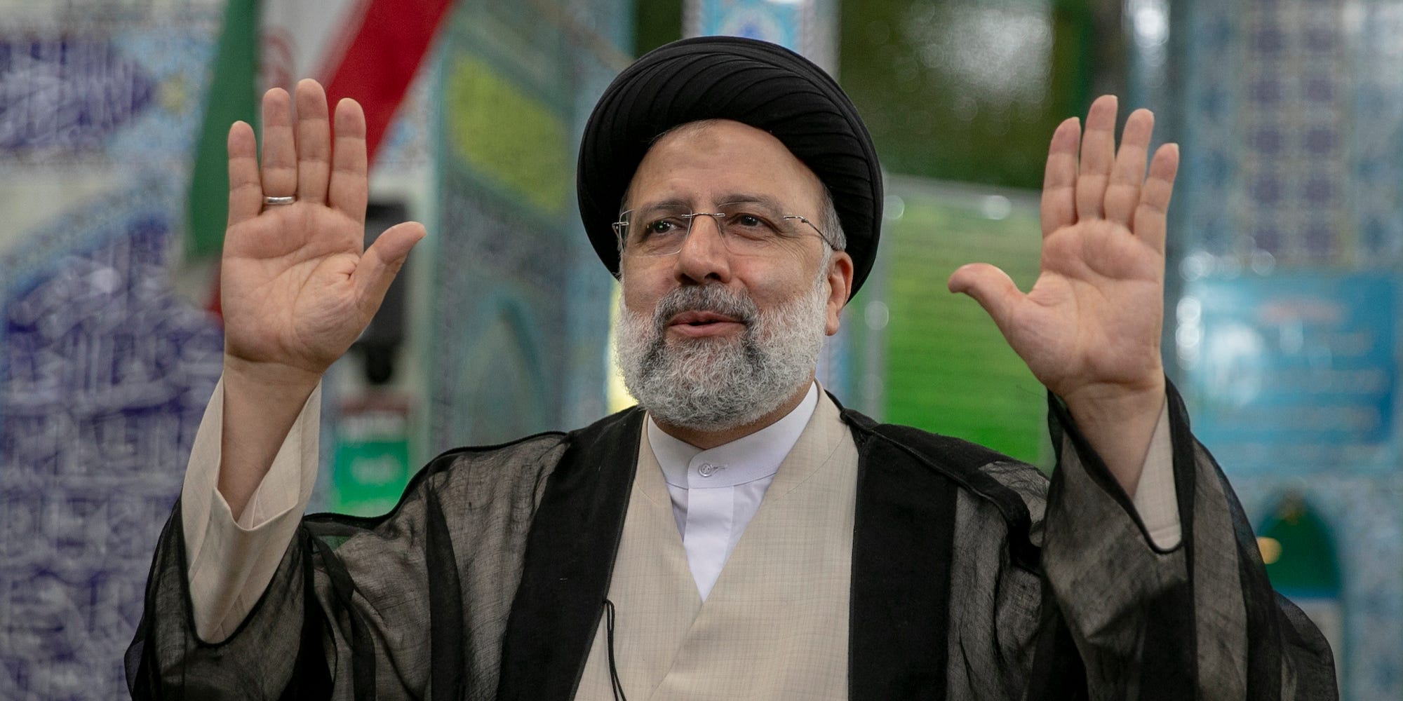 Ebrahim Raisi, Iran's new president waves to the media after casting his vote at a polling station on June 18, 2021, on the day of the Islamic republic's presidential election.