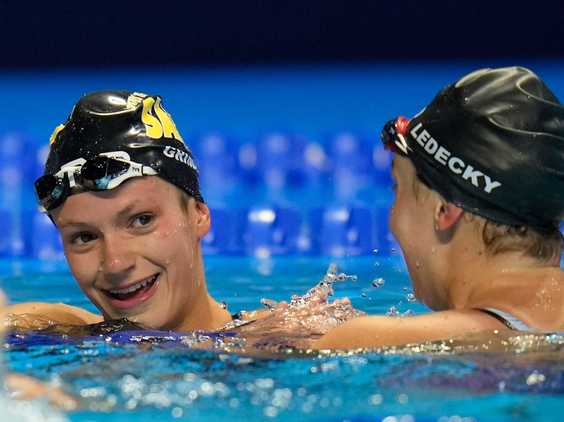 Katie Grimes (left) is congratulated by Katie Ledecky after their 800m freestyle race.