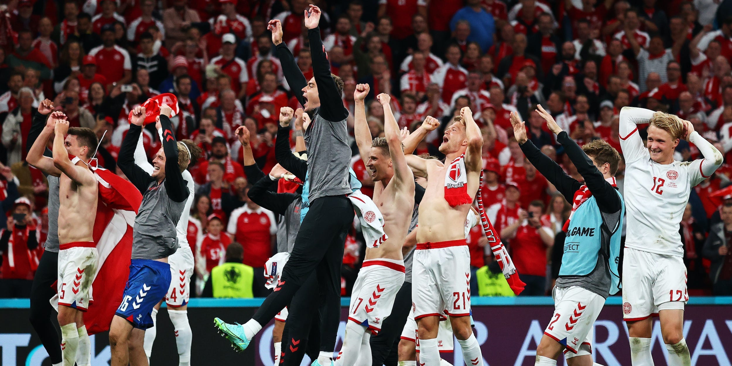 Denmark players celebrate after defeating Russia at Euro 2020