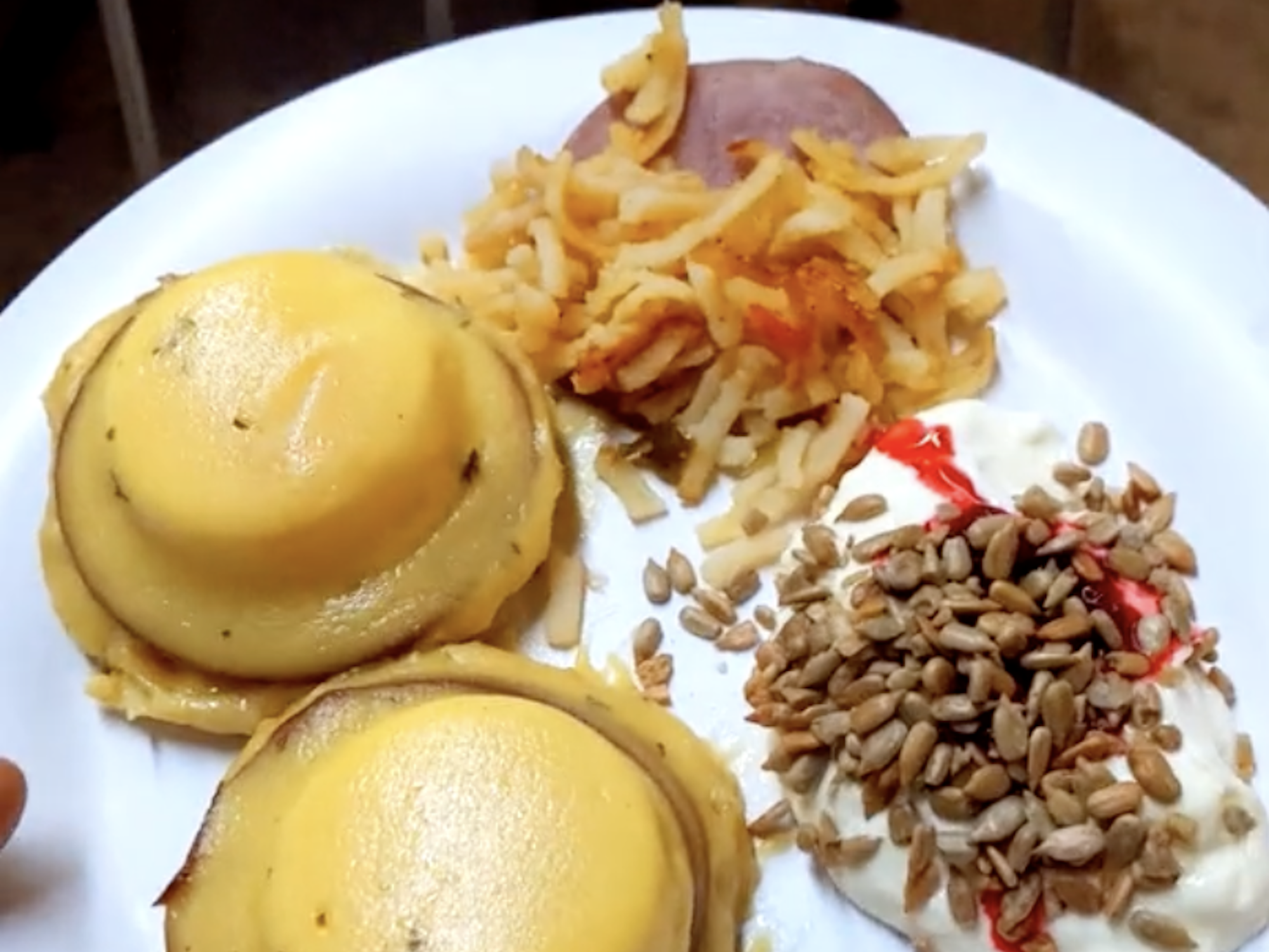 Eggs Benedict on a plate filmed at the Amundsen-Scott station.