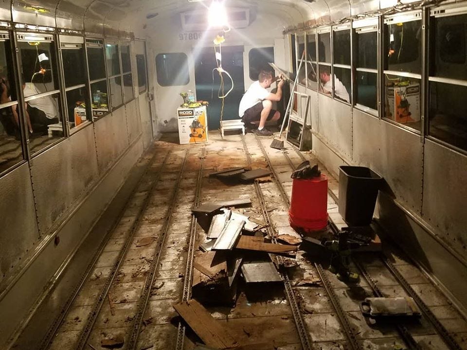 The inside of Robbie and Priscilla's school bus before they converted it into a mobile home.