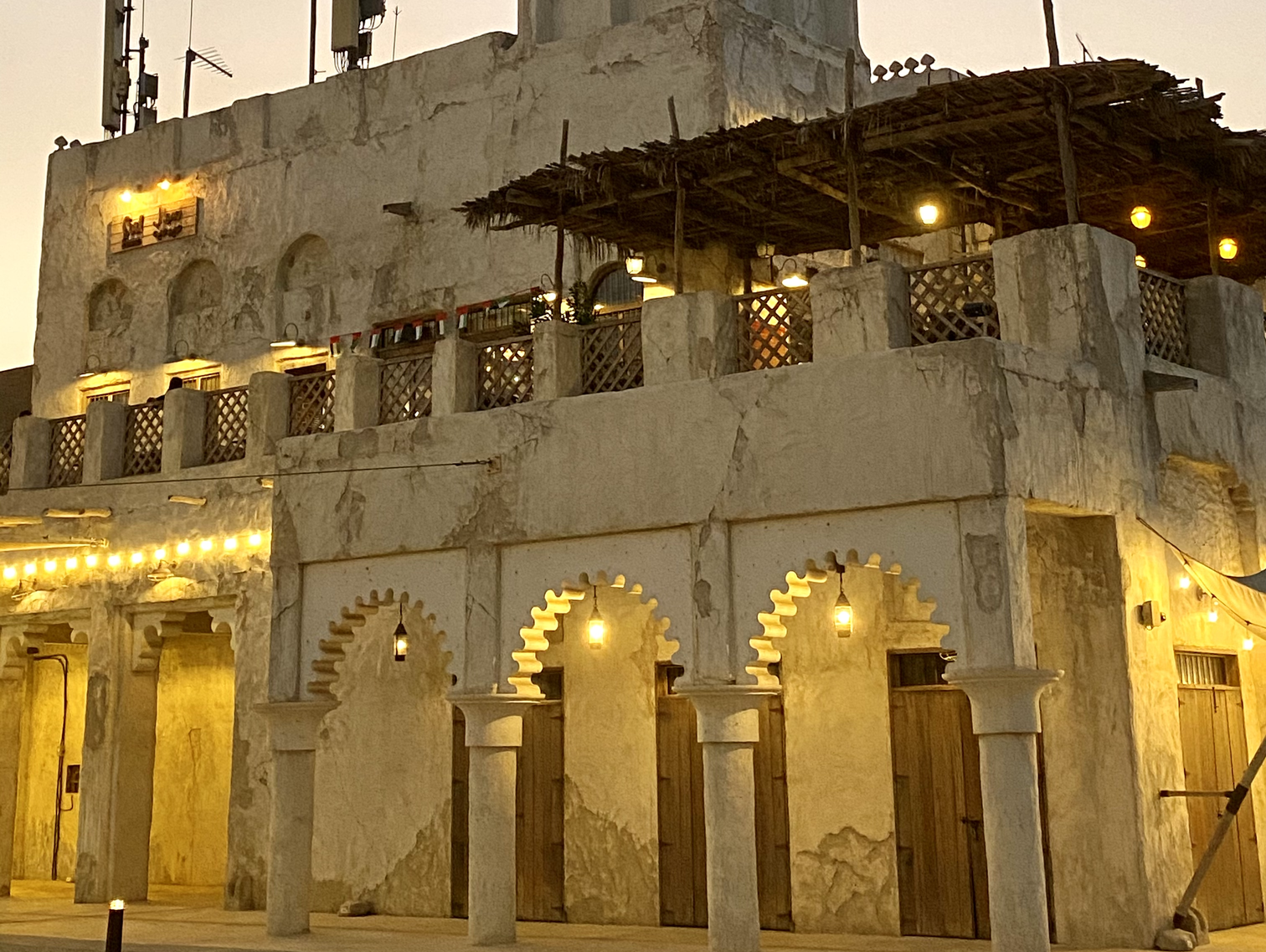 exterior shots of Heritage architecture Al Seef lit up at night in Dubai