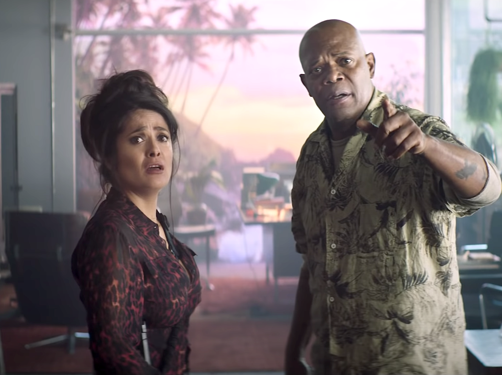 Salma Hayek and Samuel L. Jackson looking straight ahead in "The Hitman's Wife's Bodyguard."