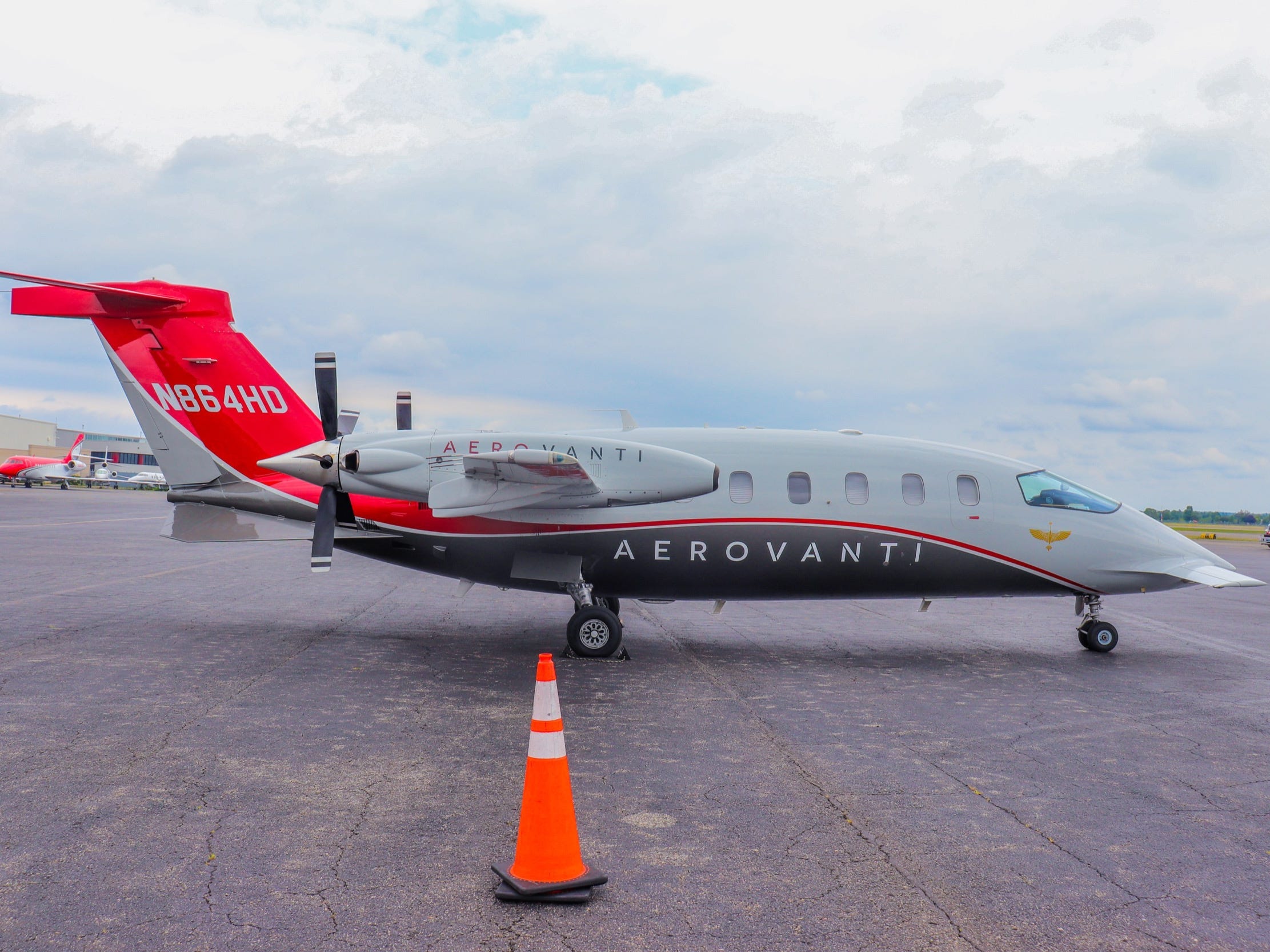 A side view of AeroVanti's Piaggio P.180 Avanti - AeroVanti's Piaggio P.180 Avanti Demonstration Private Aircraft Flight