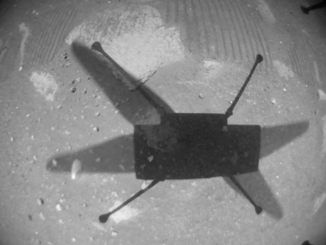 ingenuity helicopter shadow on martian ground black and white